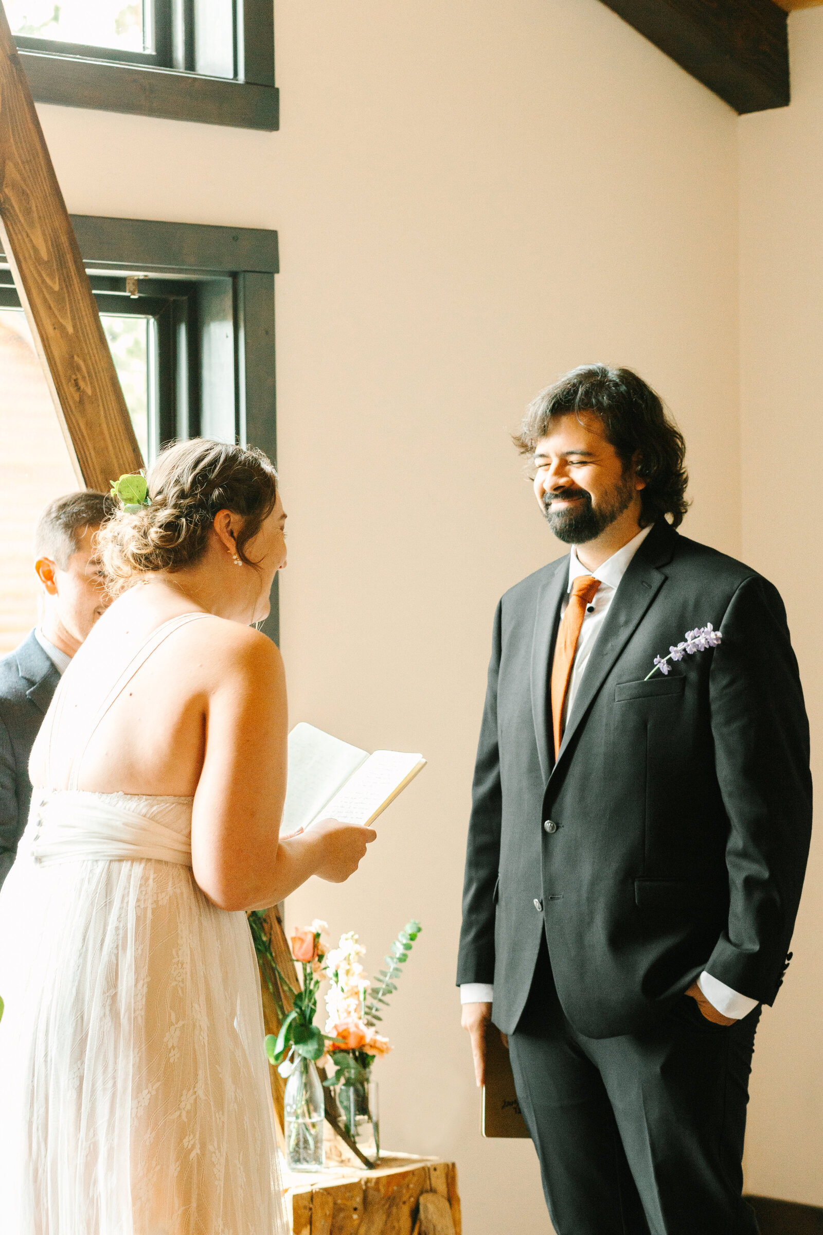 A couple celebrates their intimate elopement at a cabin at Big Bear Lake, California.