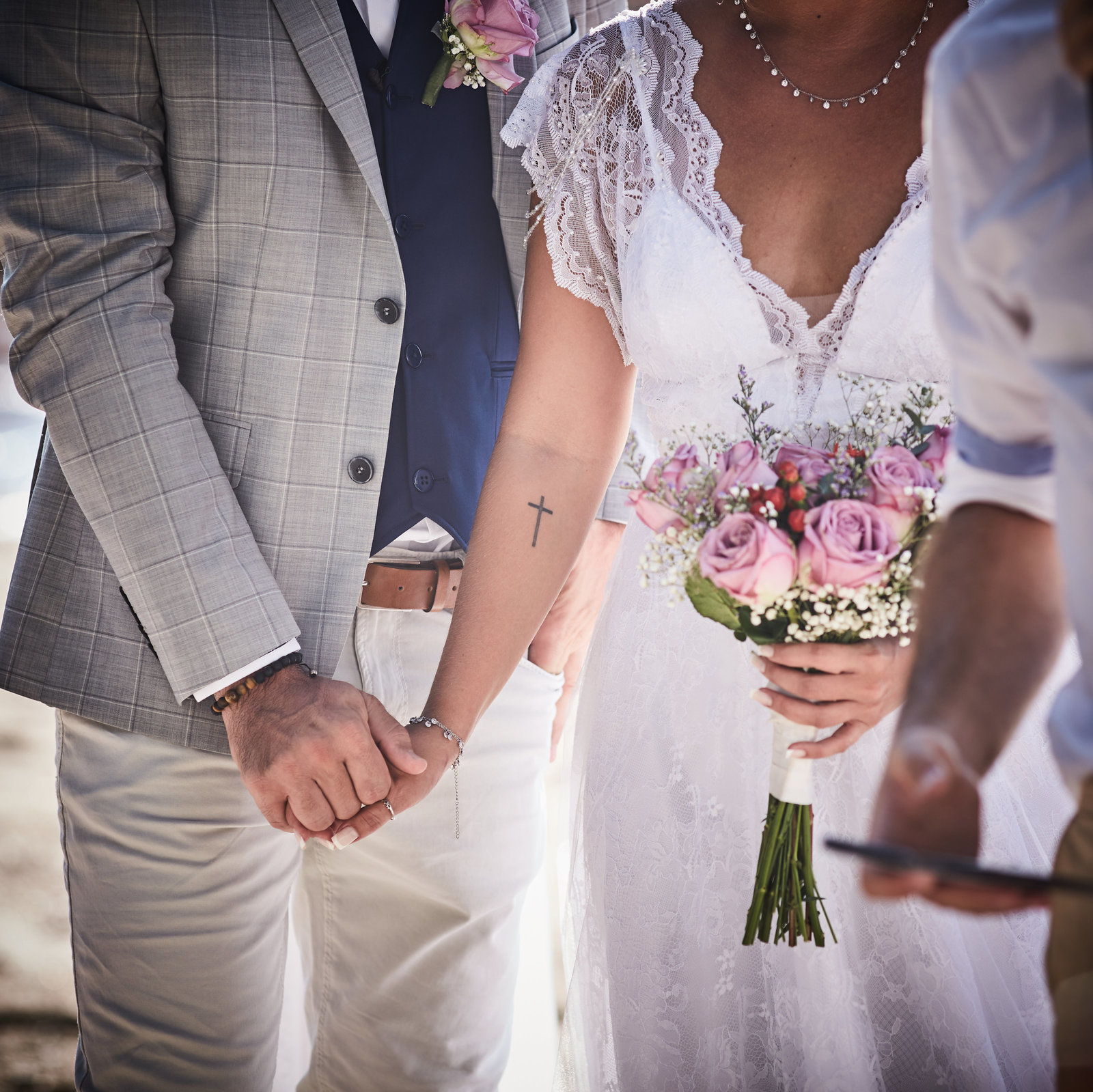 Couple holding hands during ceremony