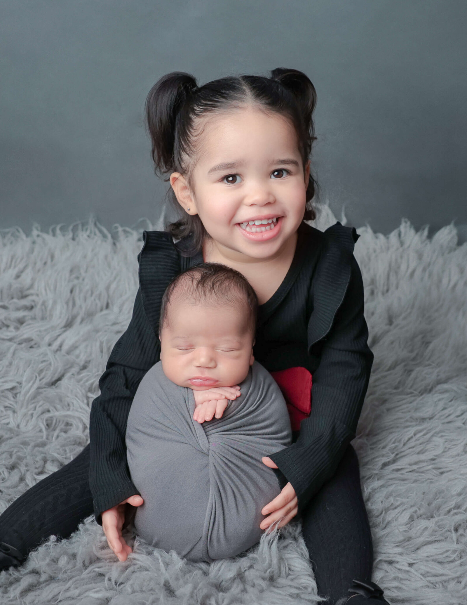 Siblings posed at our studio located in Rochester, NY.