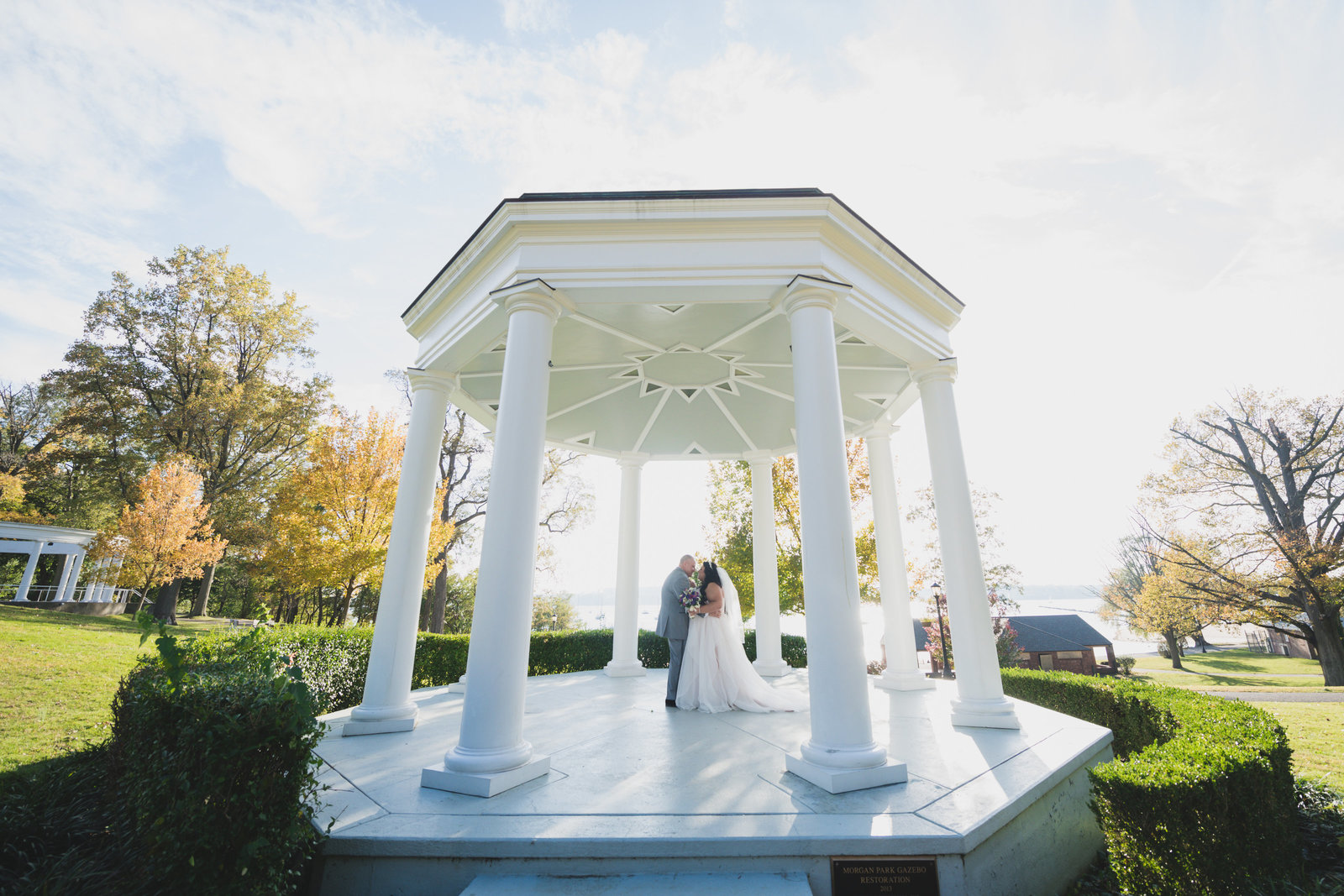 photo of bride and groom under white gazebo from wedding at Sea Cliff Manor