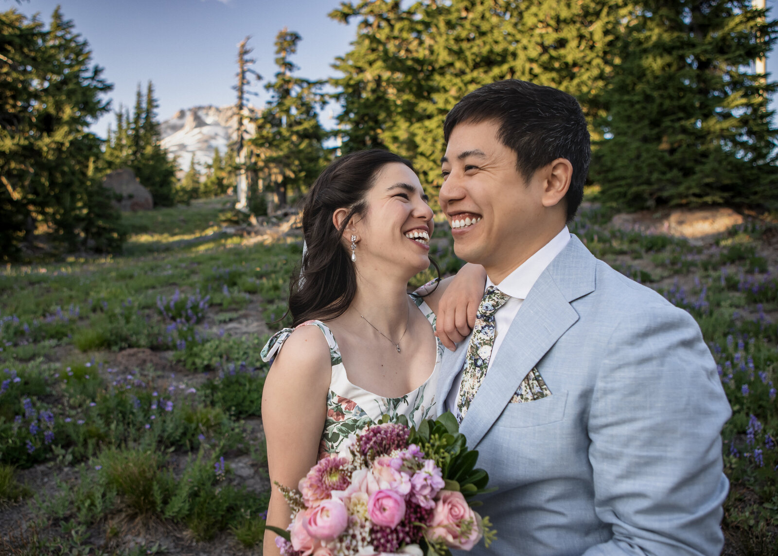 Couple laughing together during their elopement up at Timberline on Mount Hood