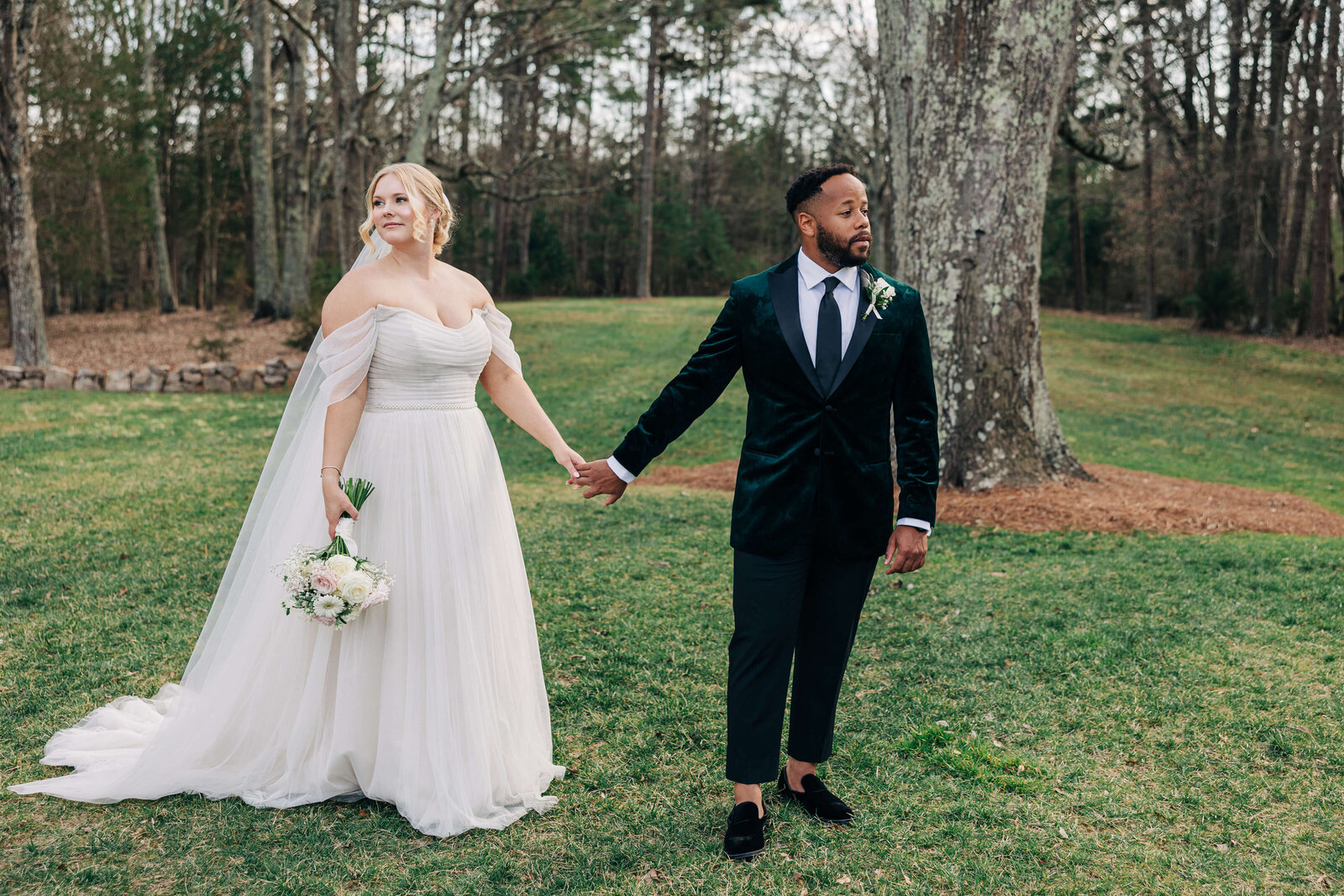 Couple-looking-off-The-Ivory-Barn