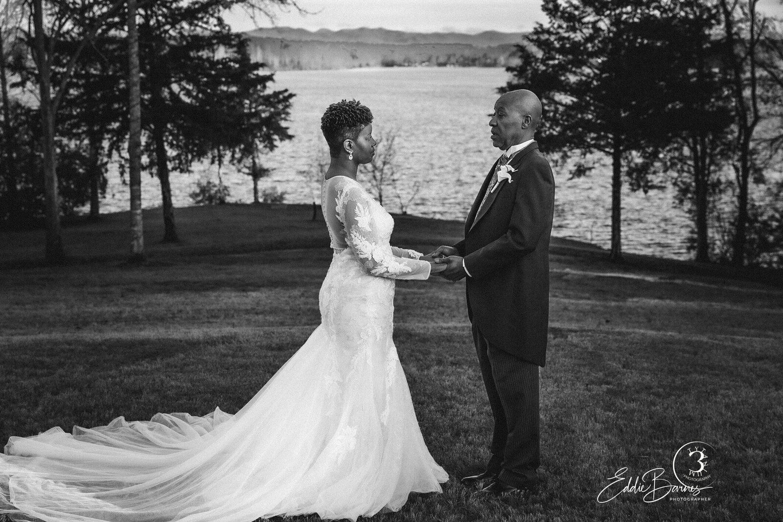 couple posing near lake