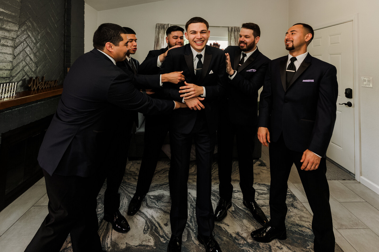 Groomsmen have a laugh with the Groom before the wedding