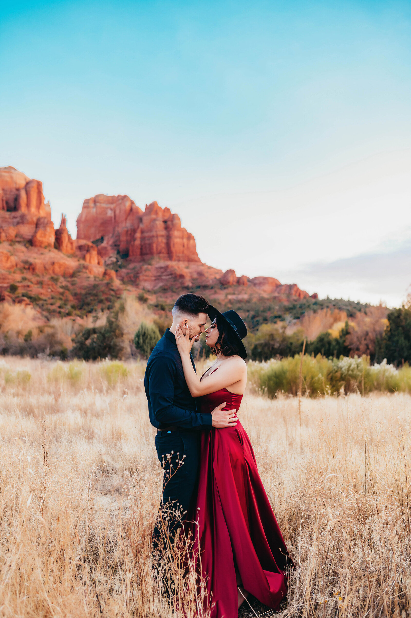 Engaged couple poses for Engagement Photos at Cathedral Rock in Sedona Arizona.