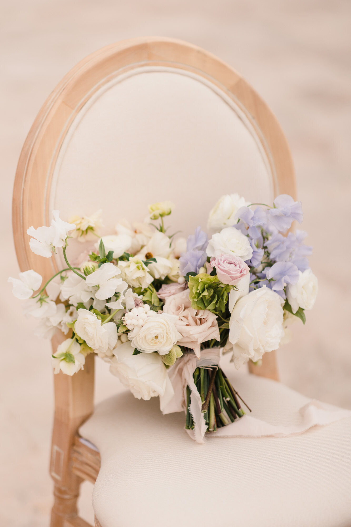 Bridal bouquet on a chair at the Villa Antonia wedding venue in Jonestown, Texas.