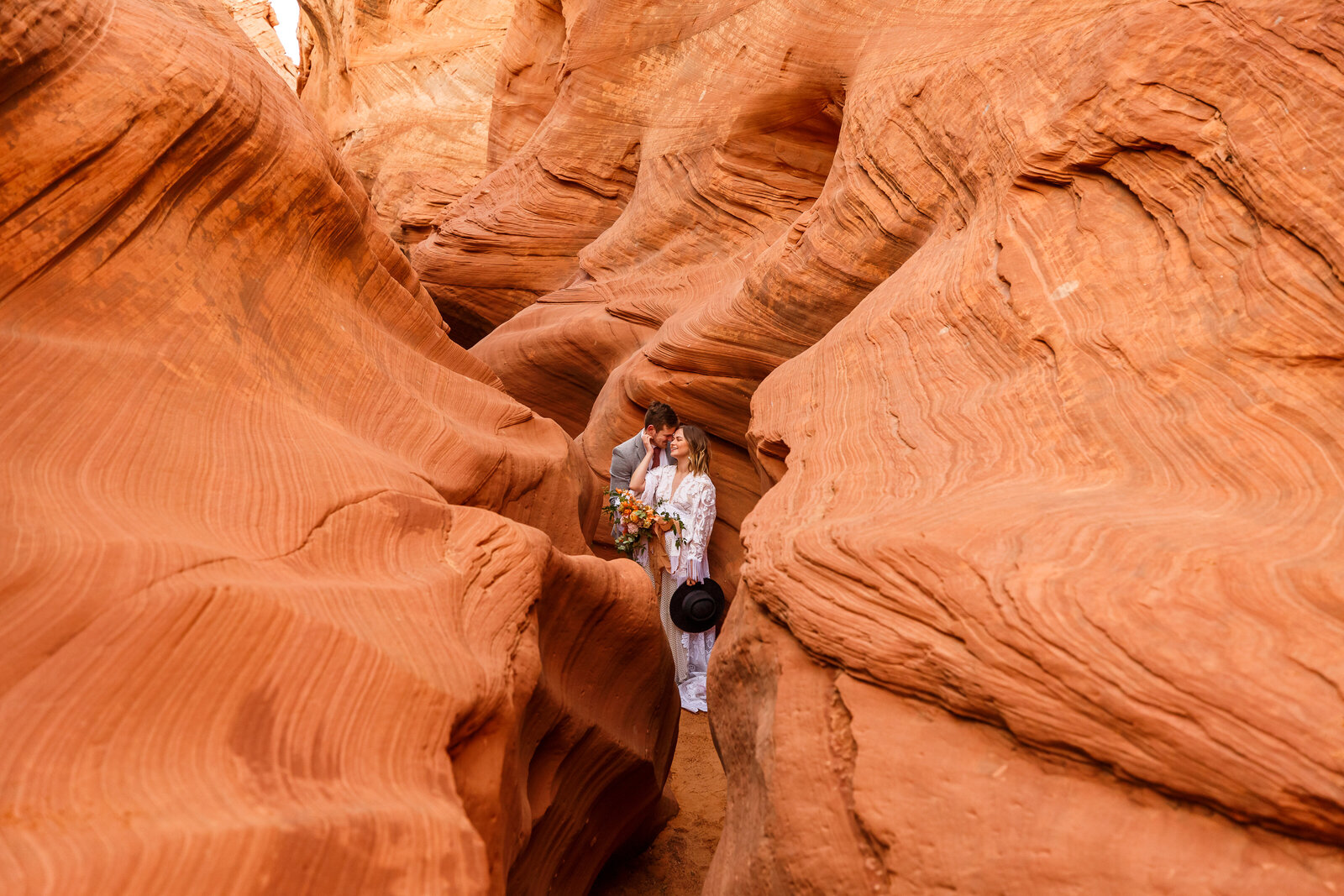 Bride and groom eloping in a slot canyon in northern Arizona.