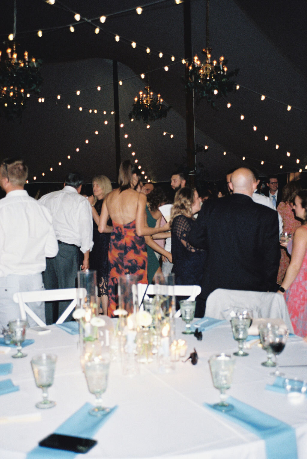 Guests dancing in the tent at night at Brittland Estate.