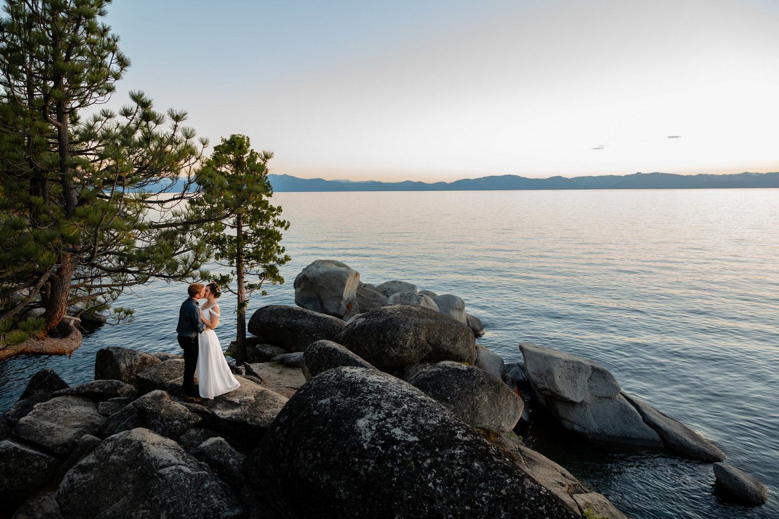 wedding couple kissing on the tahoe beach 