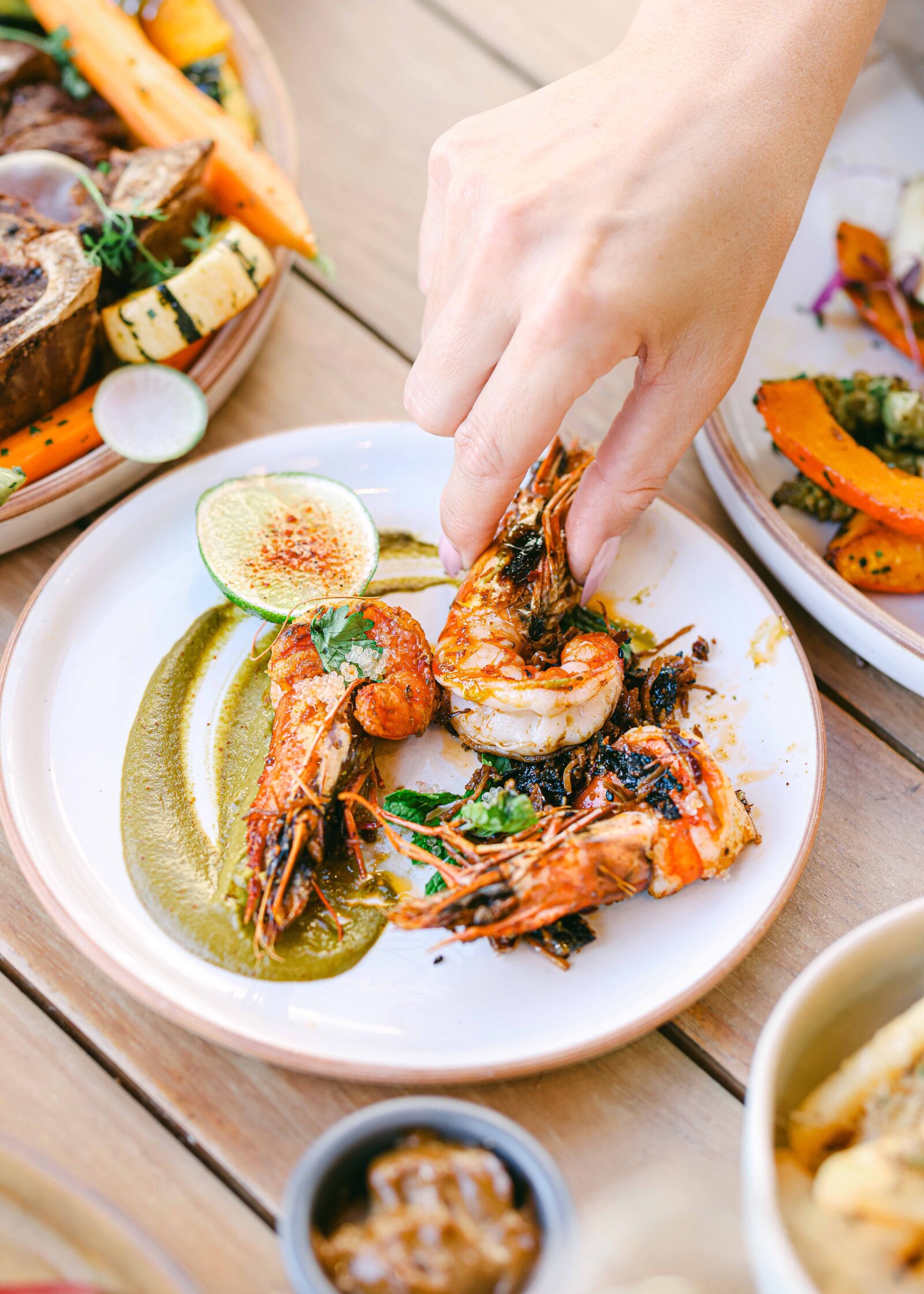 lifestyle hotel photography for food hand reaching