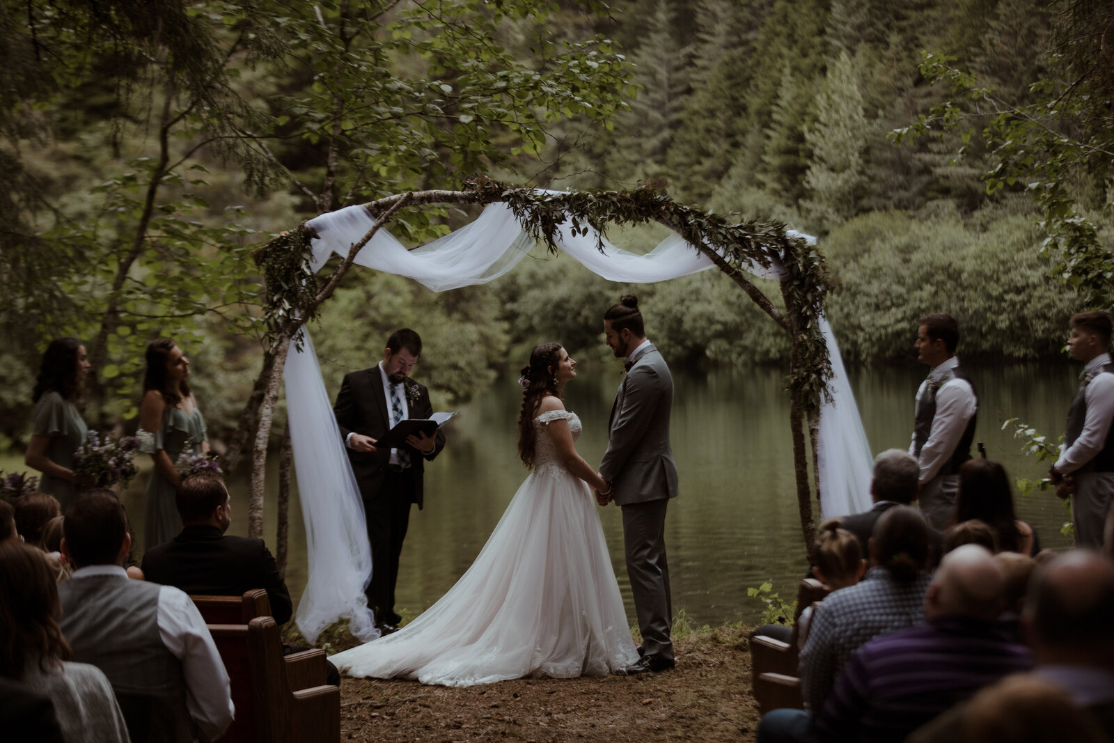 Bride and groom getting married in the forrest