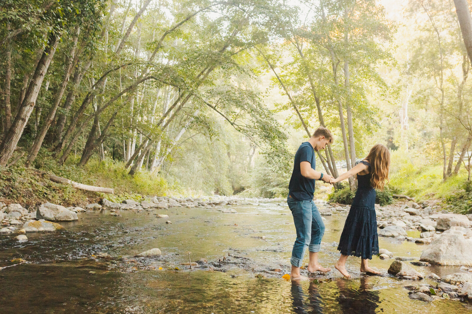 A couple poses for their engagement photos in Big Sur, California.
