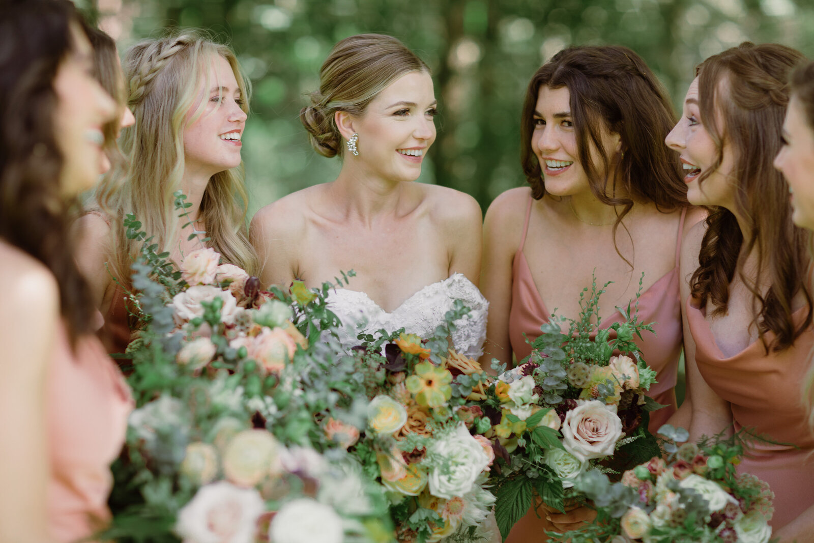bridal party with bride holding flowers