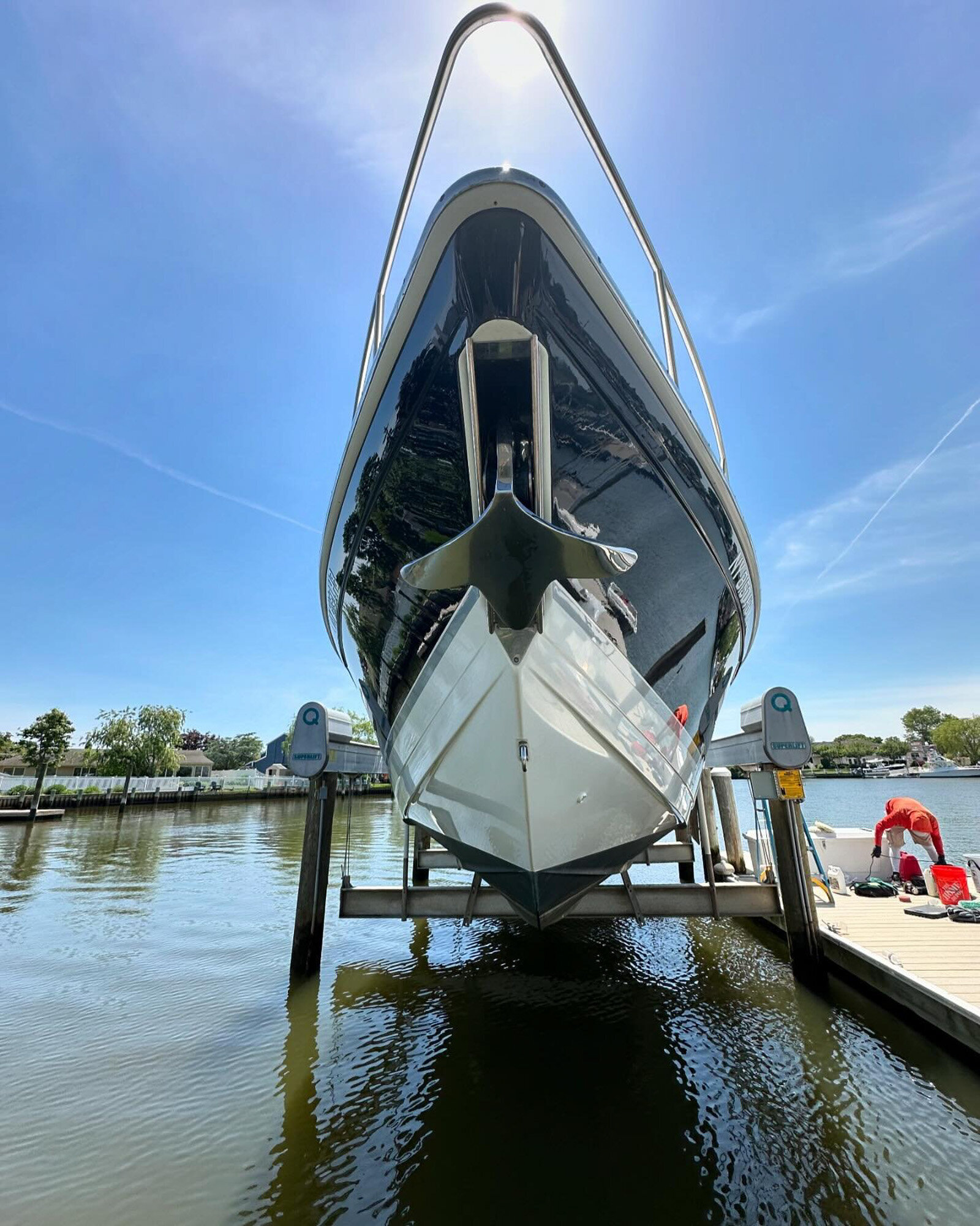 Front view of a yacht lifted out of the water for detailing
