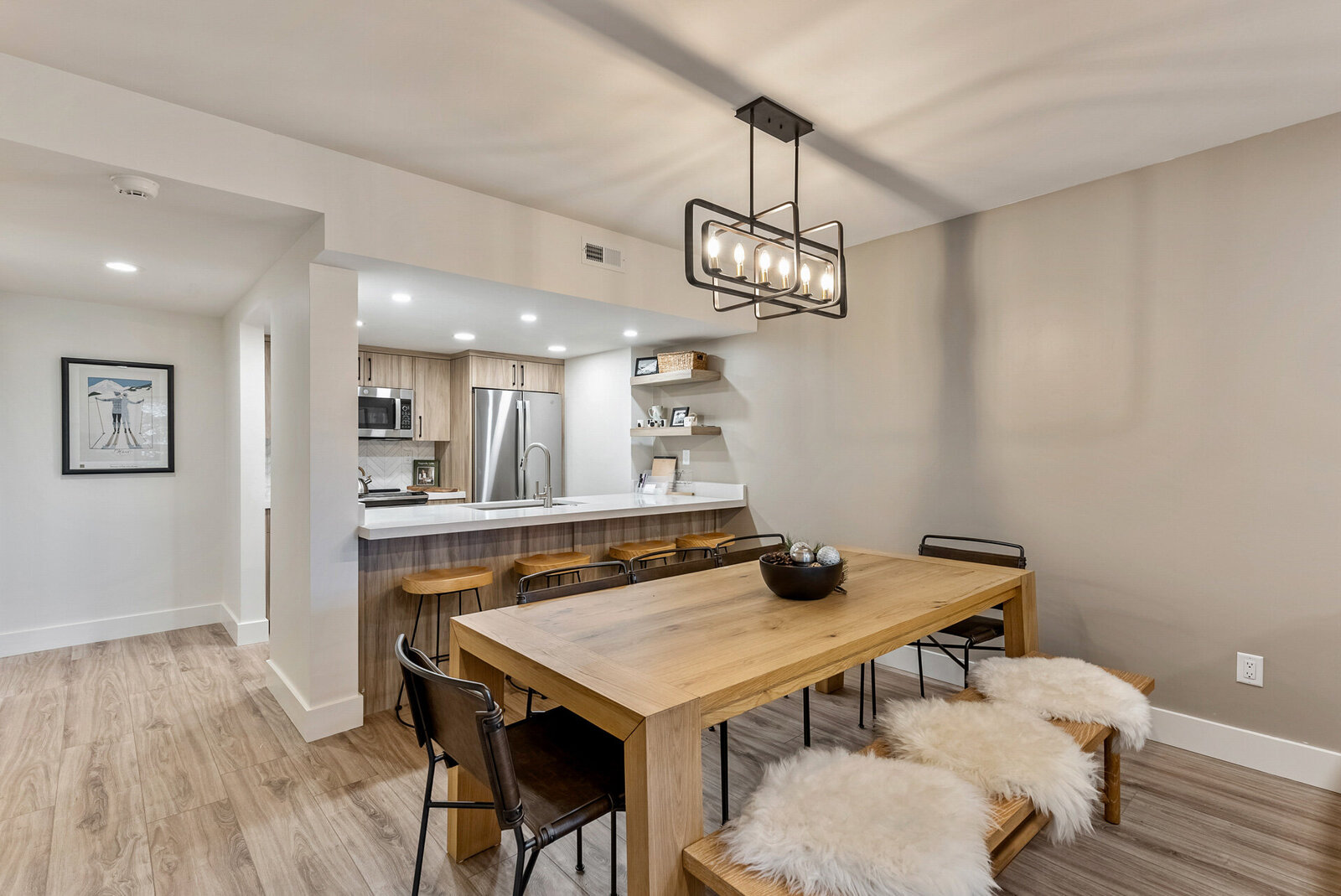 Vacation-Home-Interior-Designer-Chalet-and-Co-wood-dining-table-and-modern-light-fixture