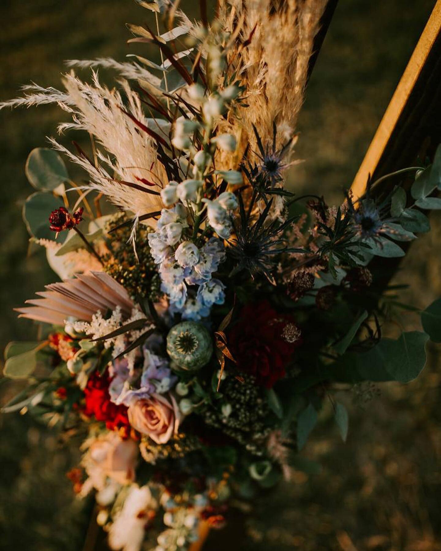 flowers attached to a wood arch