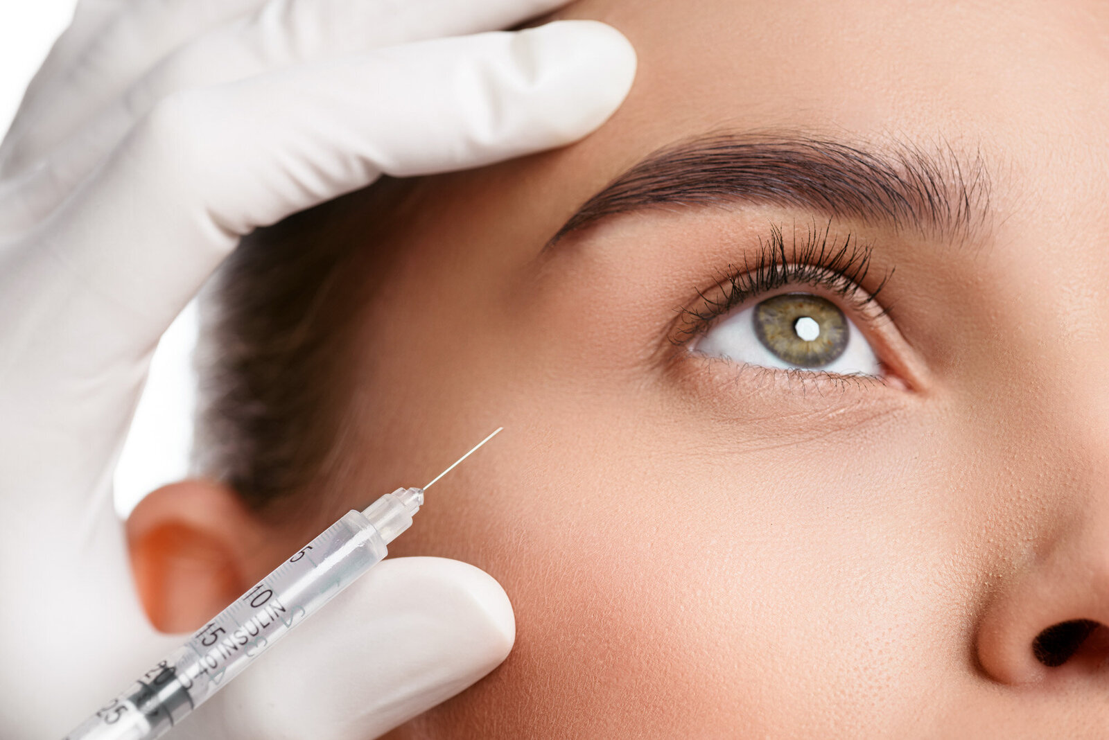 neurotoxin botox treatment on woman with green eyes
