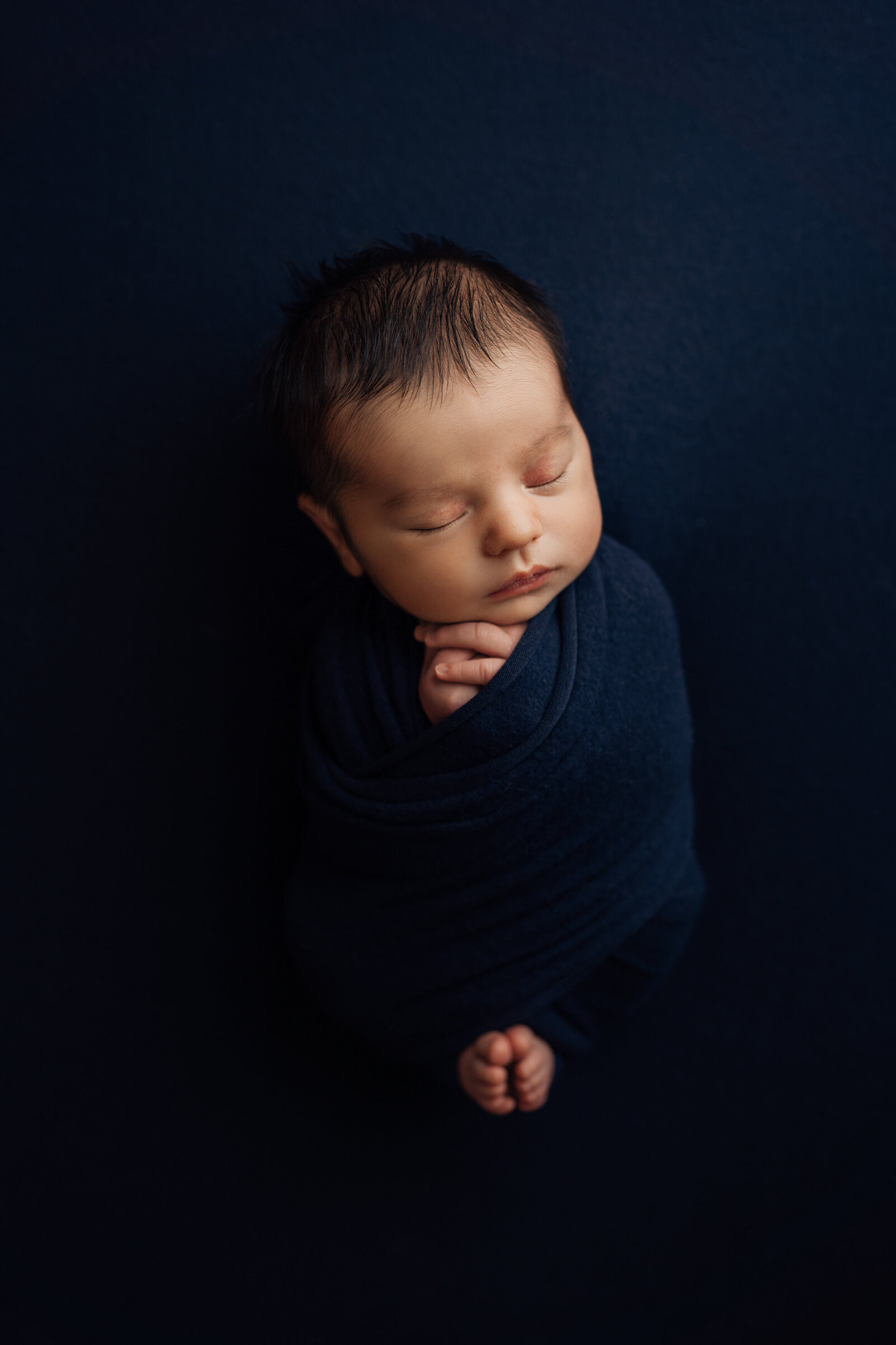 newborn boy sleeping during photo session in Wesley Chapel