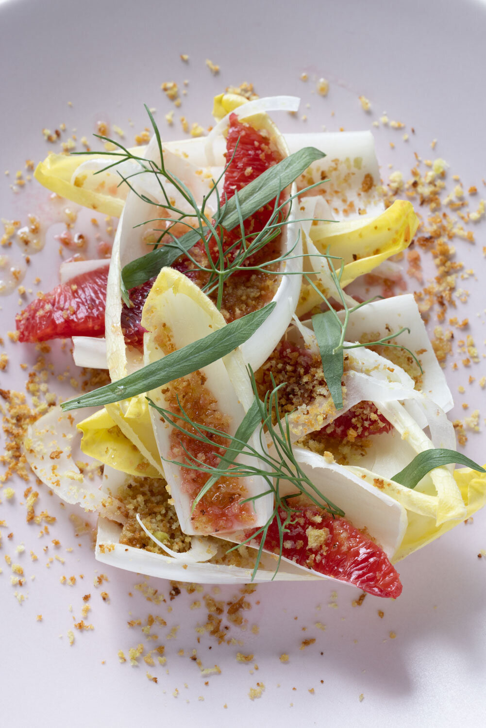 Endive salad with grapefruit, fig, breadcrumbs, and fresh herbs