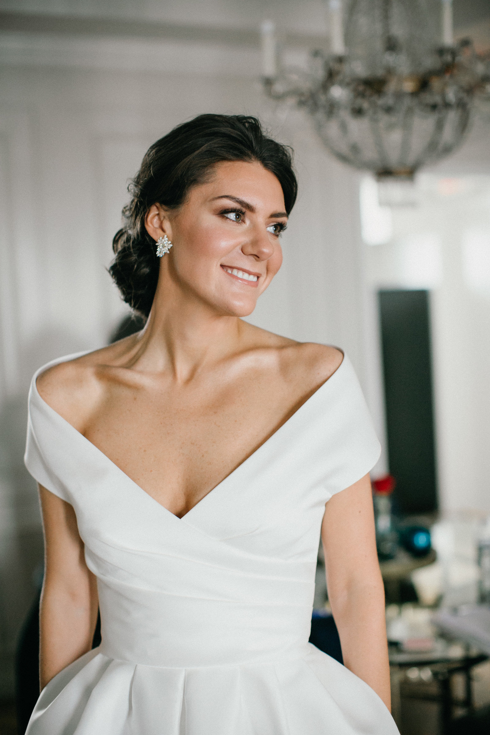 Our bride photographed getting ready at Philadelphia's Ritz Carlton wearing a  gorgeous Le spose di Gio bridal gown.