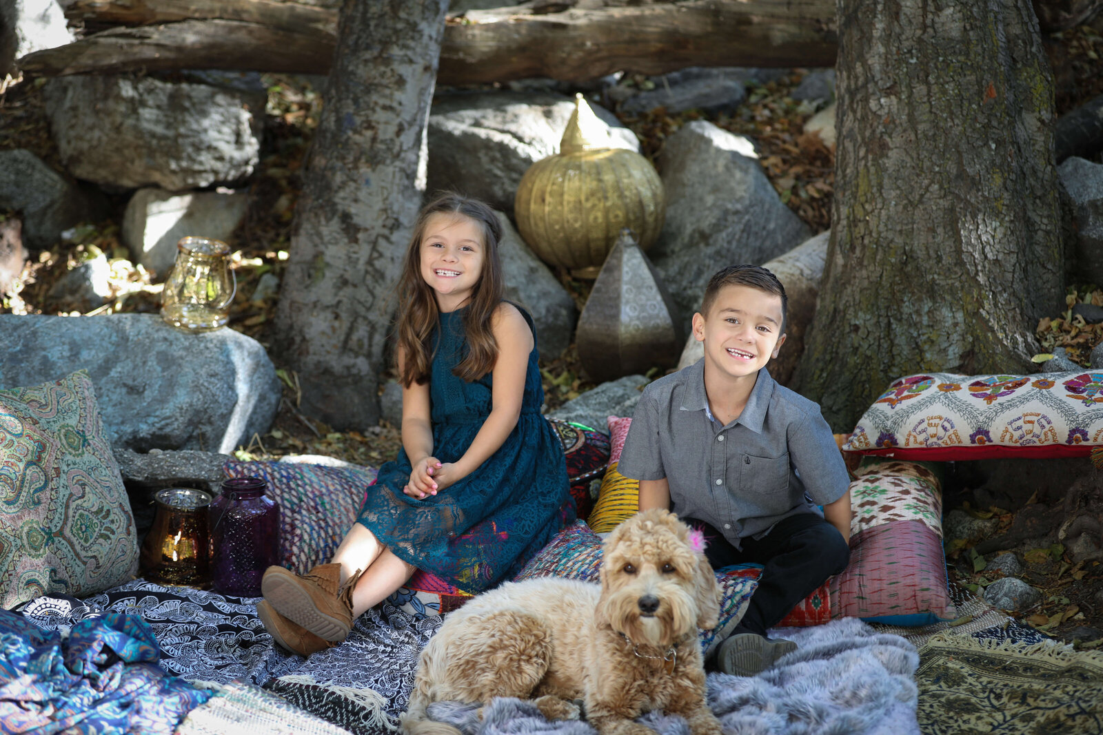 Weddings and Family Portraits in Orange County boy and girl sitting with dog on blanket
