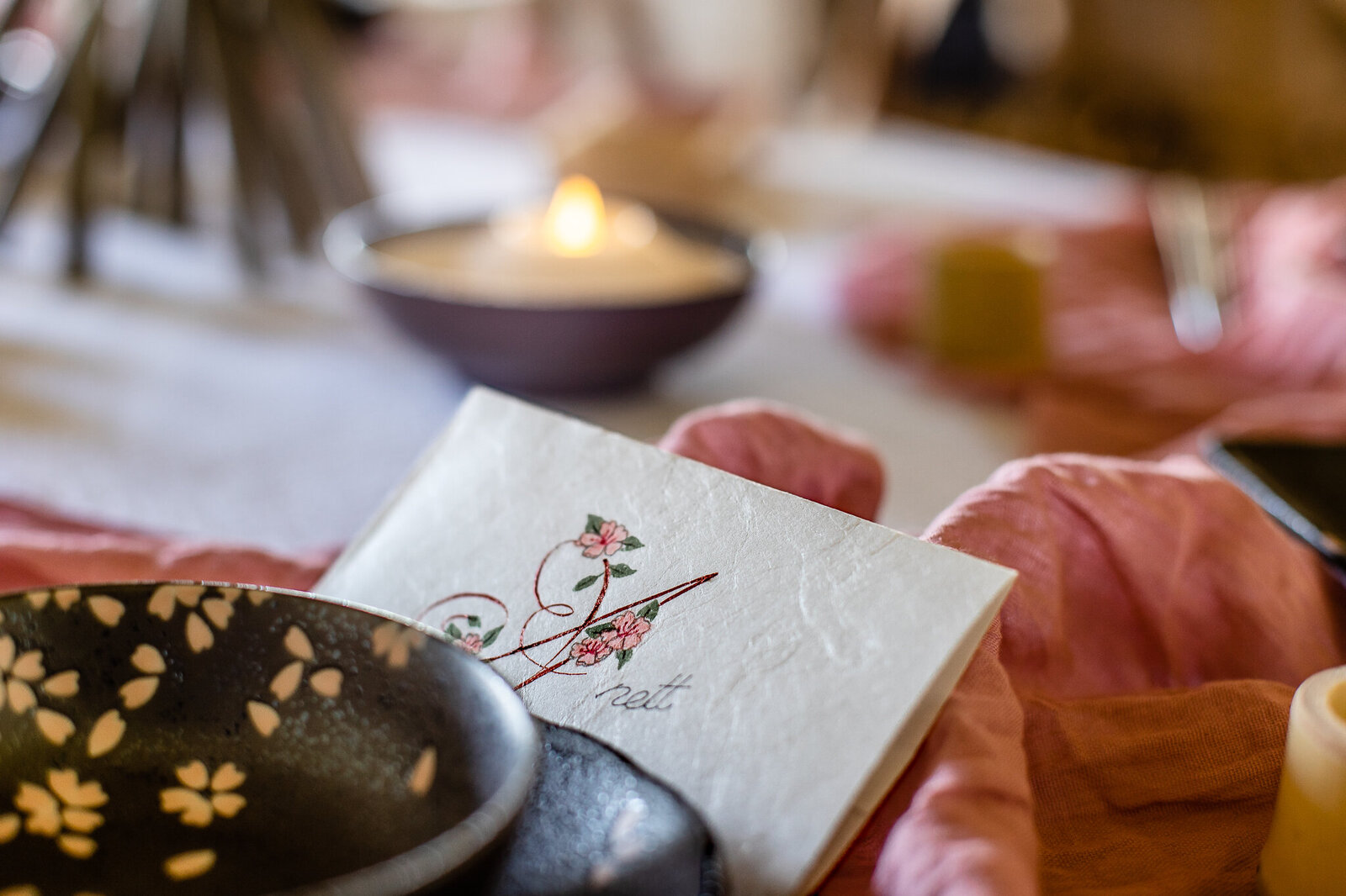 Place card with cherry blossom and calligraphy