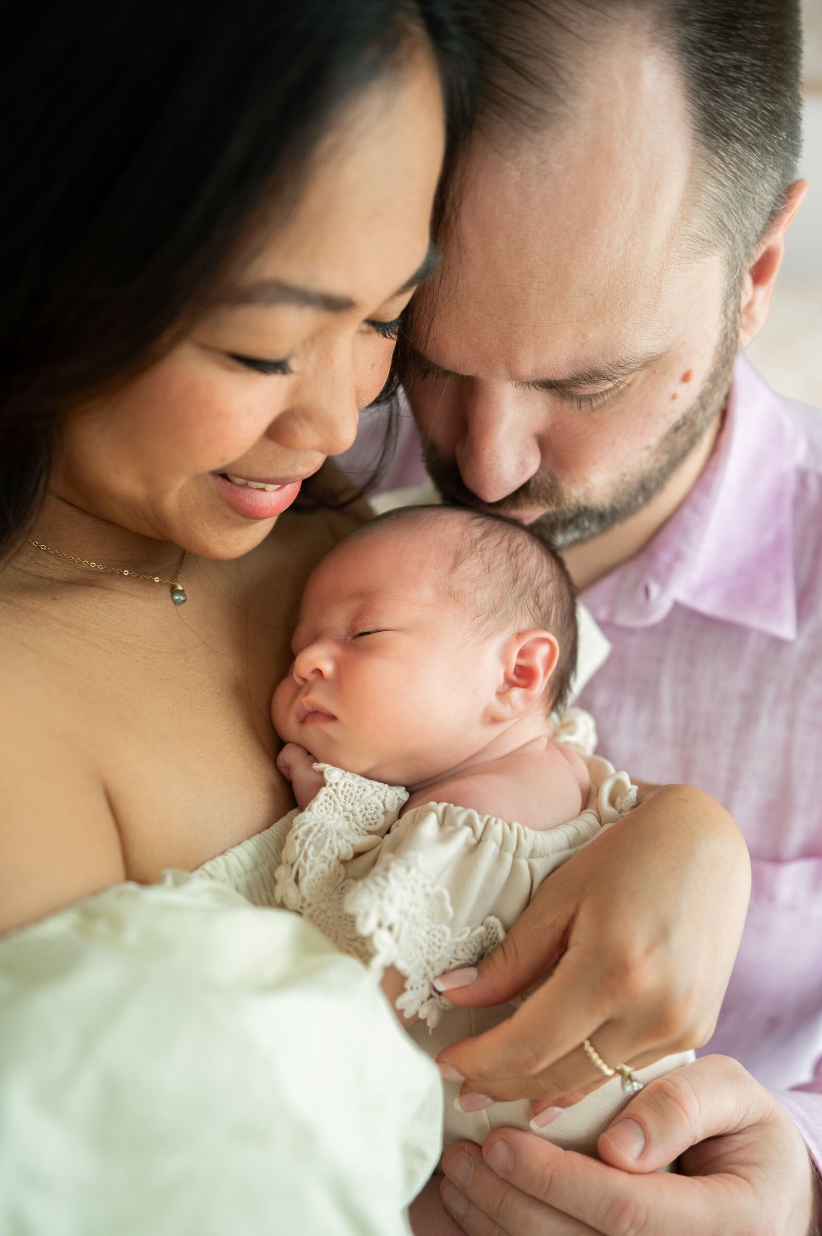 family of 3 at a studio newborn session