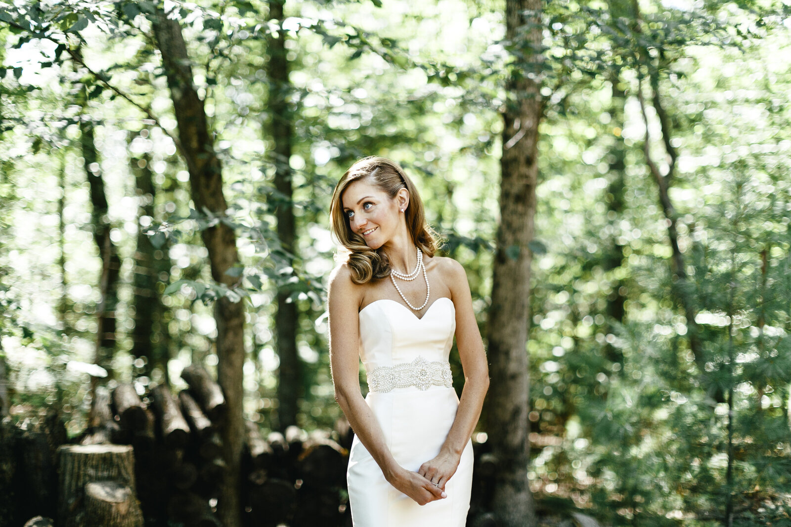 bride with pearls in farm woods