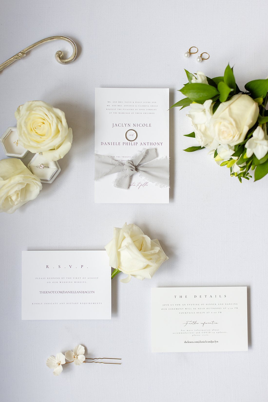 Elegant-Wedding-day-invitation-pieces-surrounded-by-flowers-in-ontario-canada