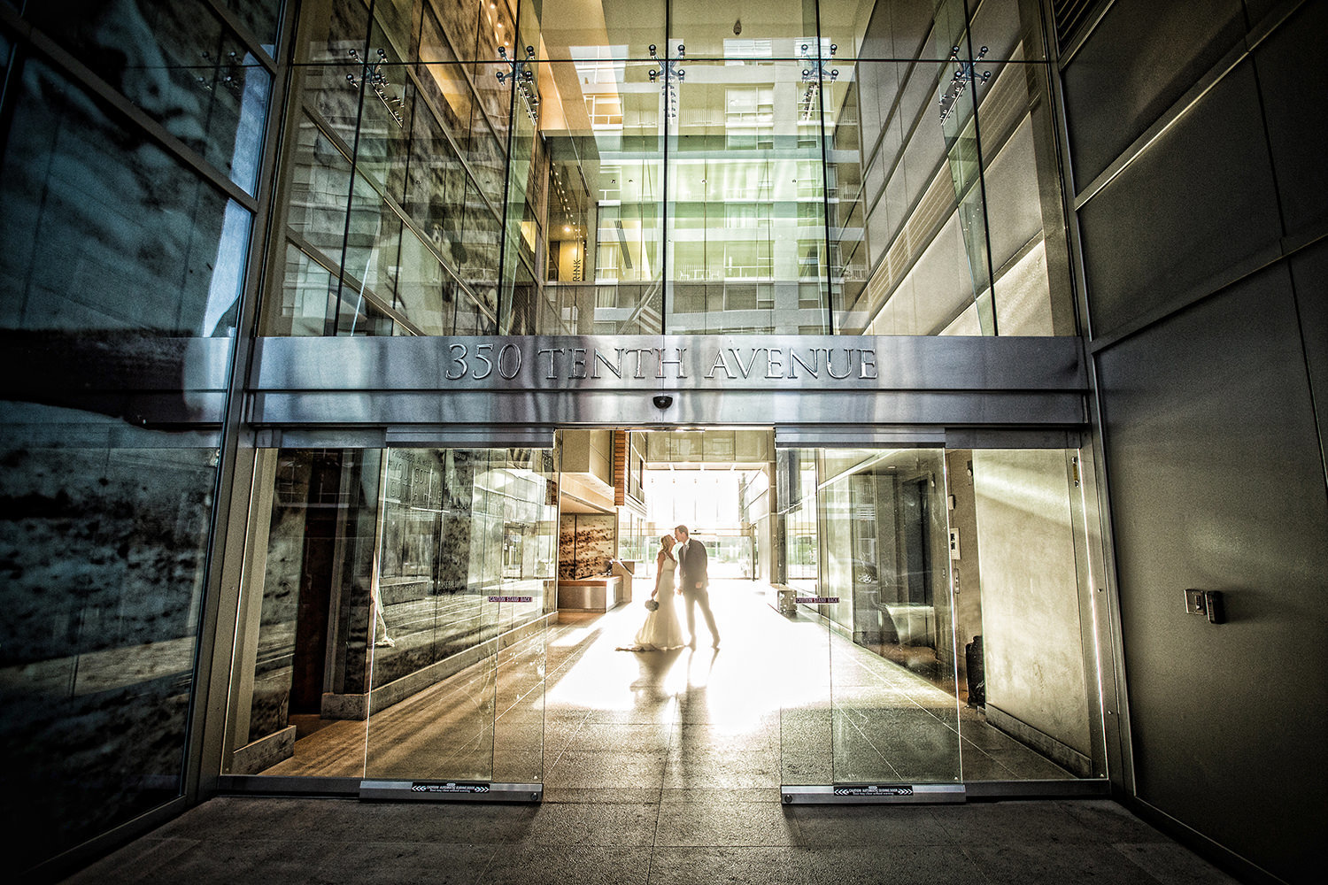 Wedding portrait with dramatic architecture at the Ultimate Skybox downtown