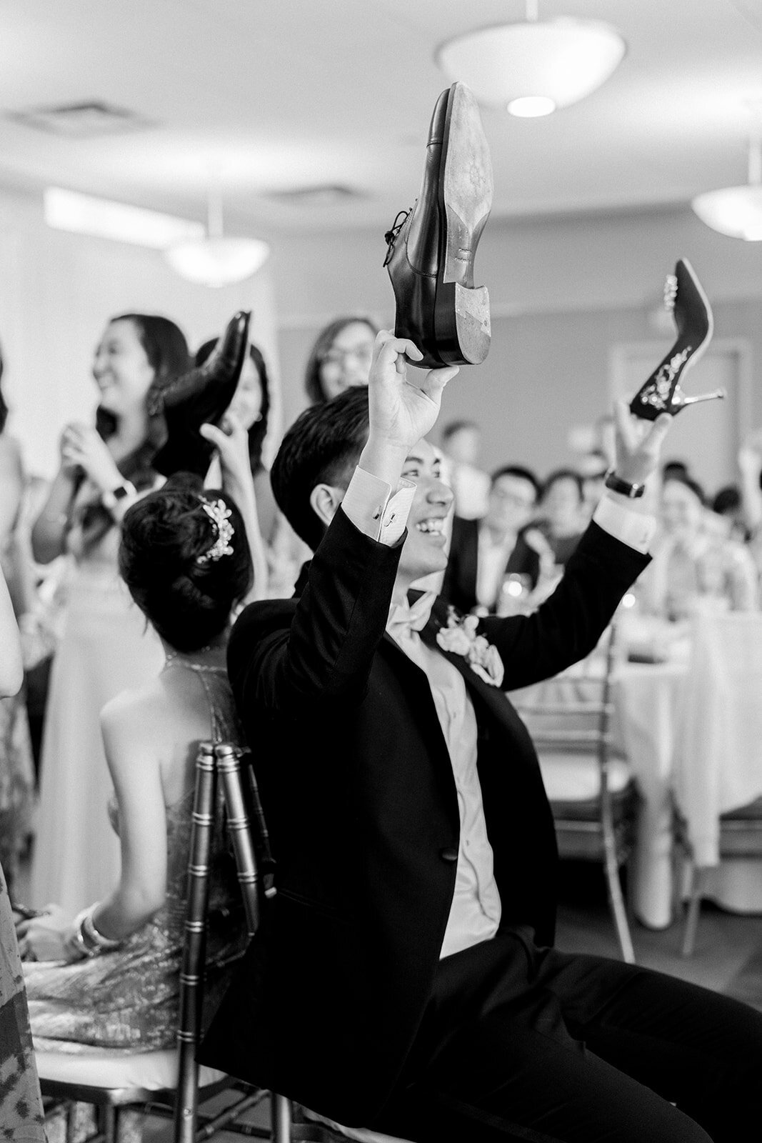 The wedding party and guests share a joyous celebration at Stanford University, capturing the spirit of the day.