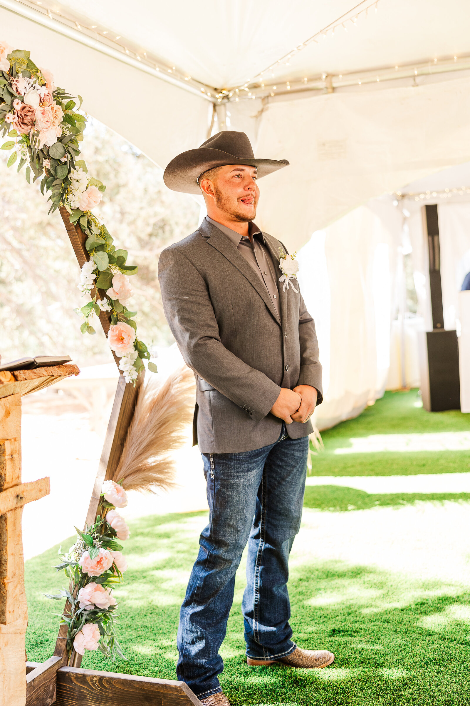 Sweet photo of grooms face as he awaits his bride walking down the isle in Arrowhead CO