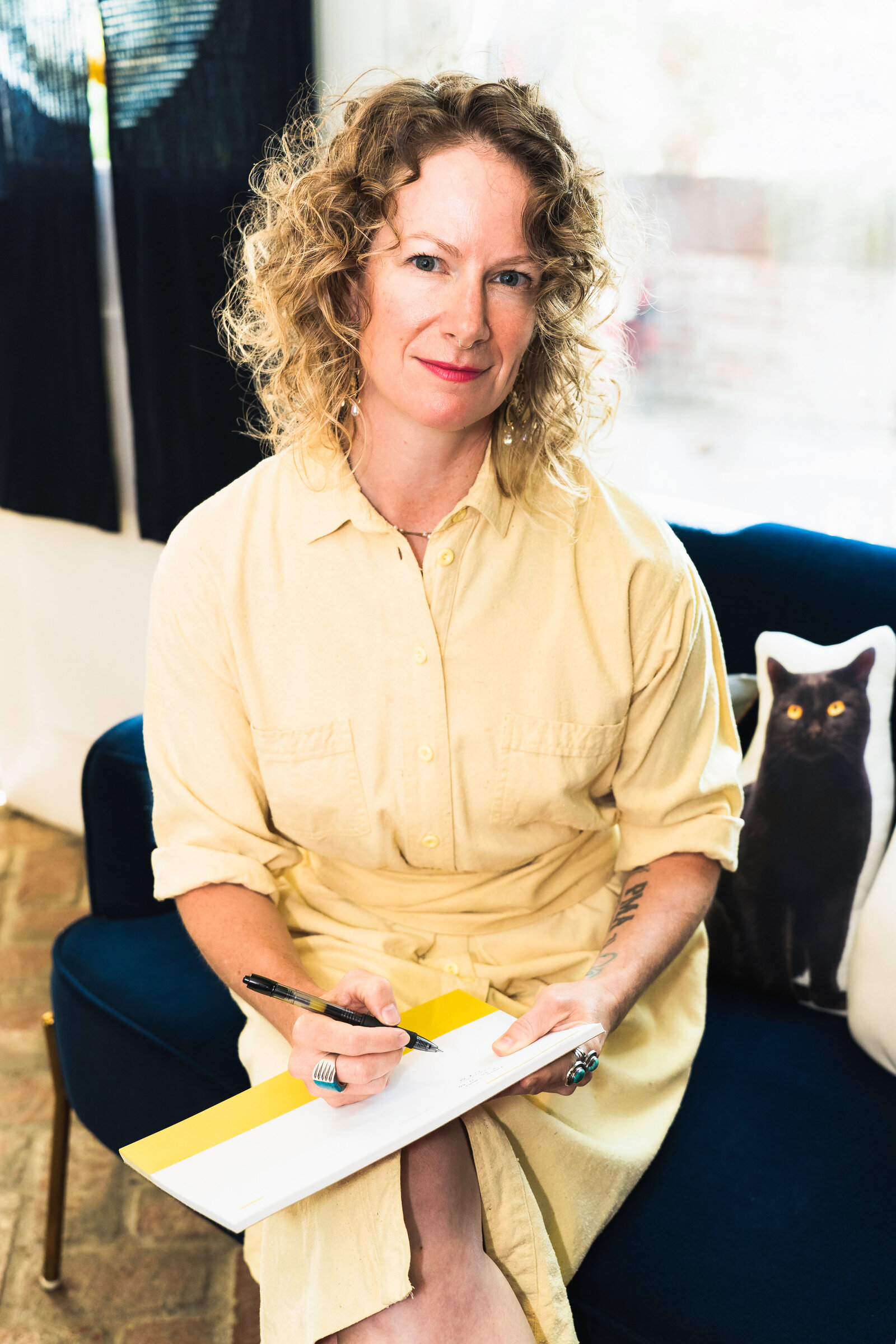 small business owner is taking notes in her agenda