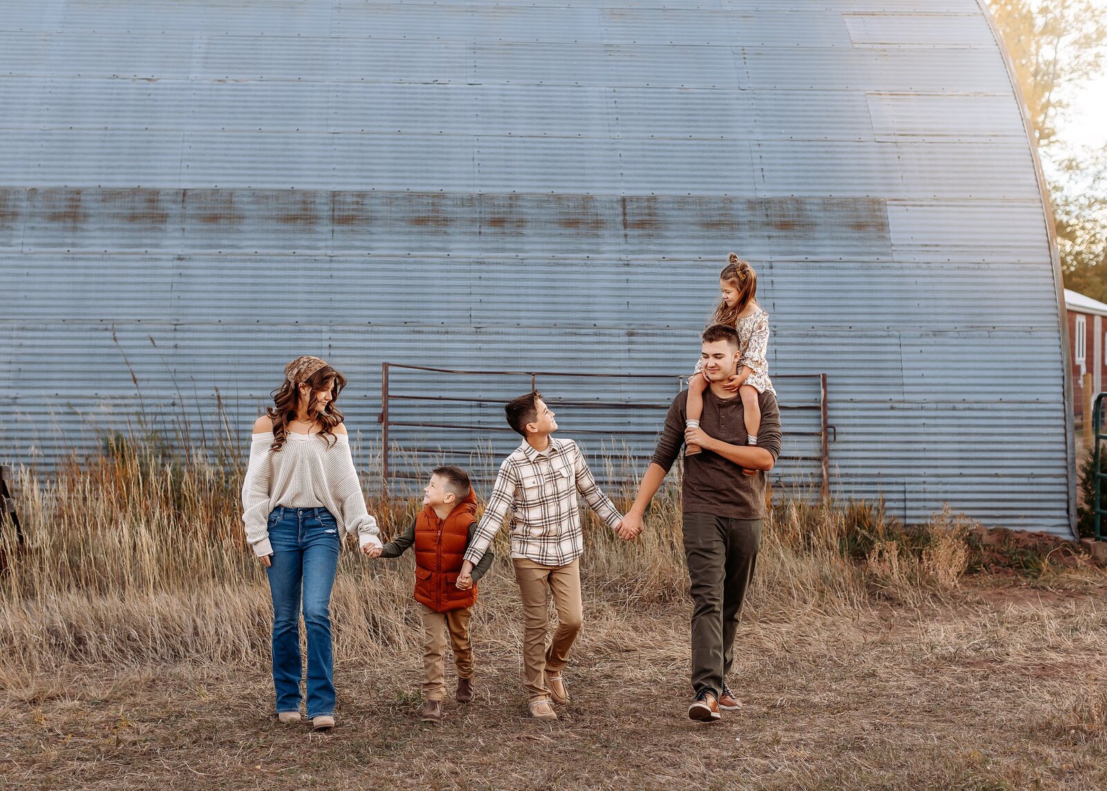 siblings having fun at circle pine ranch for their denver family photos