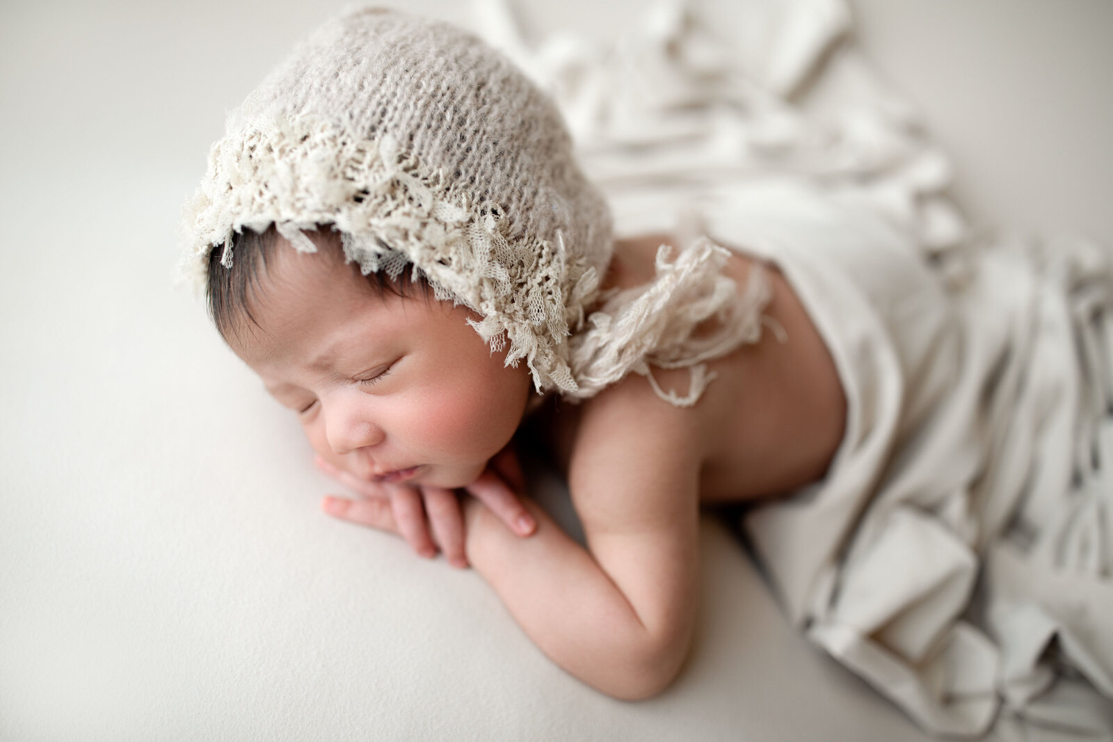 Cozy, swaddled newborn portraits that highlight the warmth and comfort of your baby’s first days, crafted with expert posing and soft fabrics.