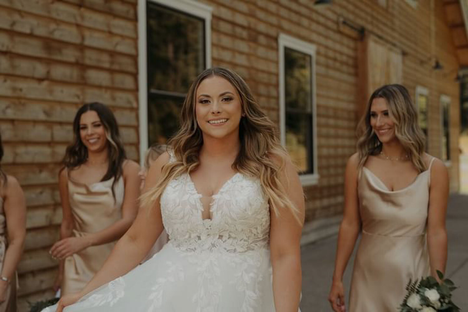 A bride walking with her bridesmaids, glowing with confidence