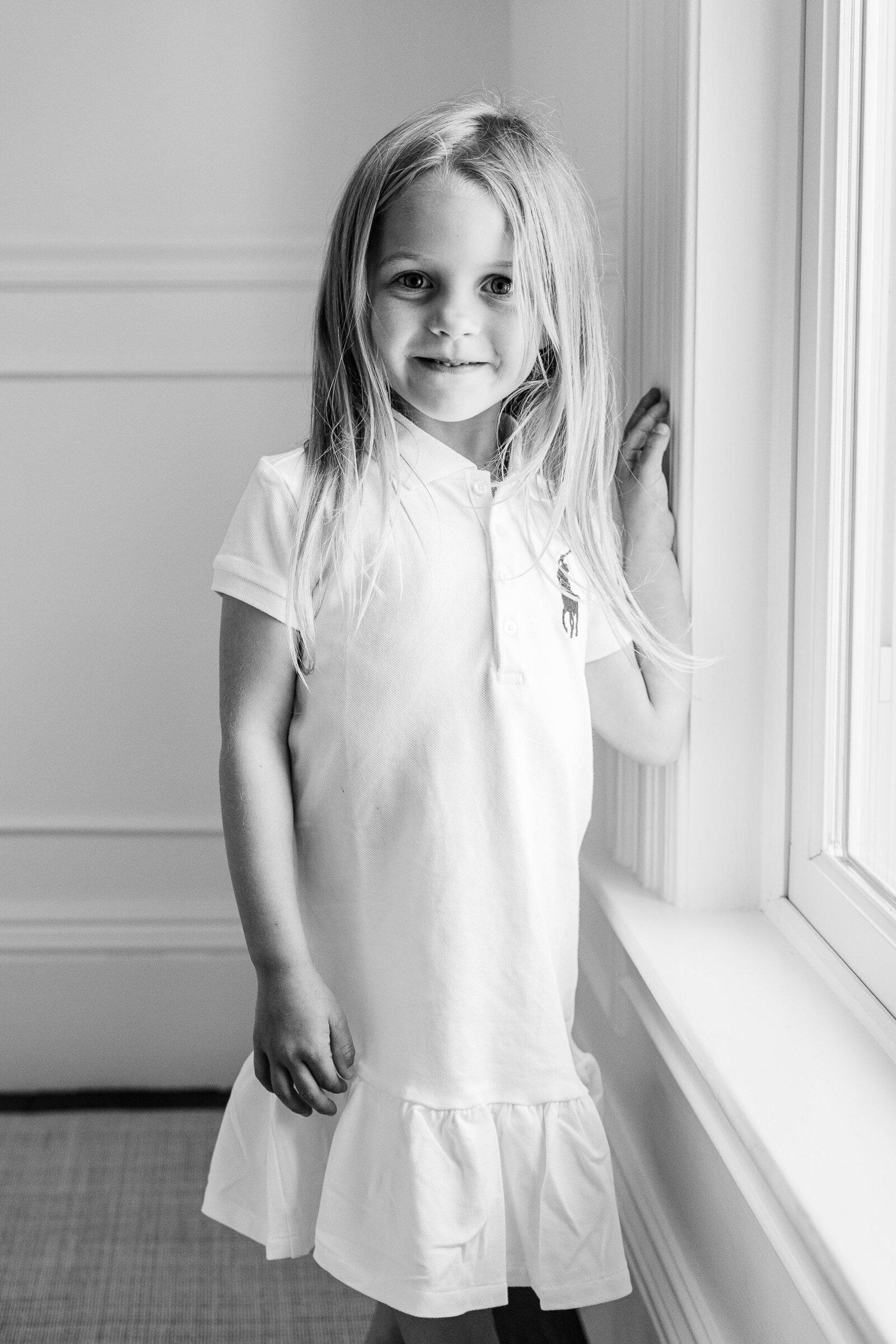 black and white image of girl in white dress