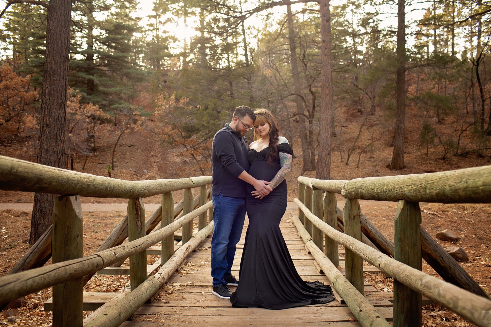 Albuquerque-maternity-session-couple-on-a-bridge-in-the-mountains