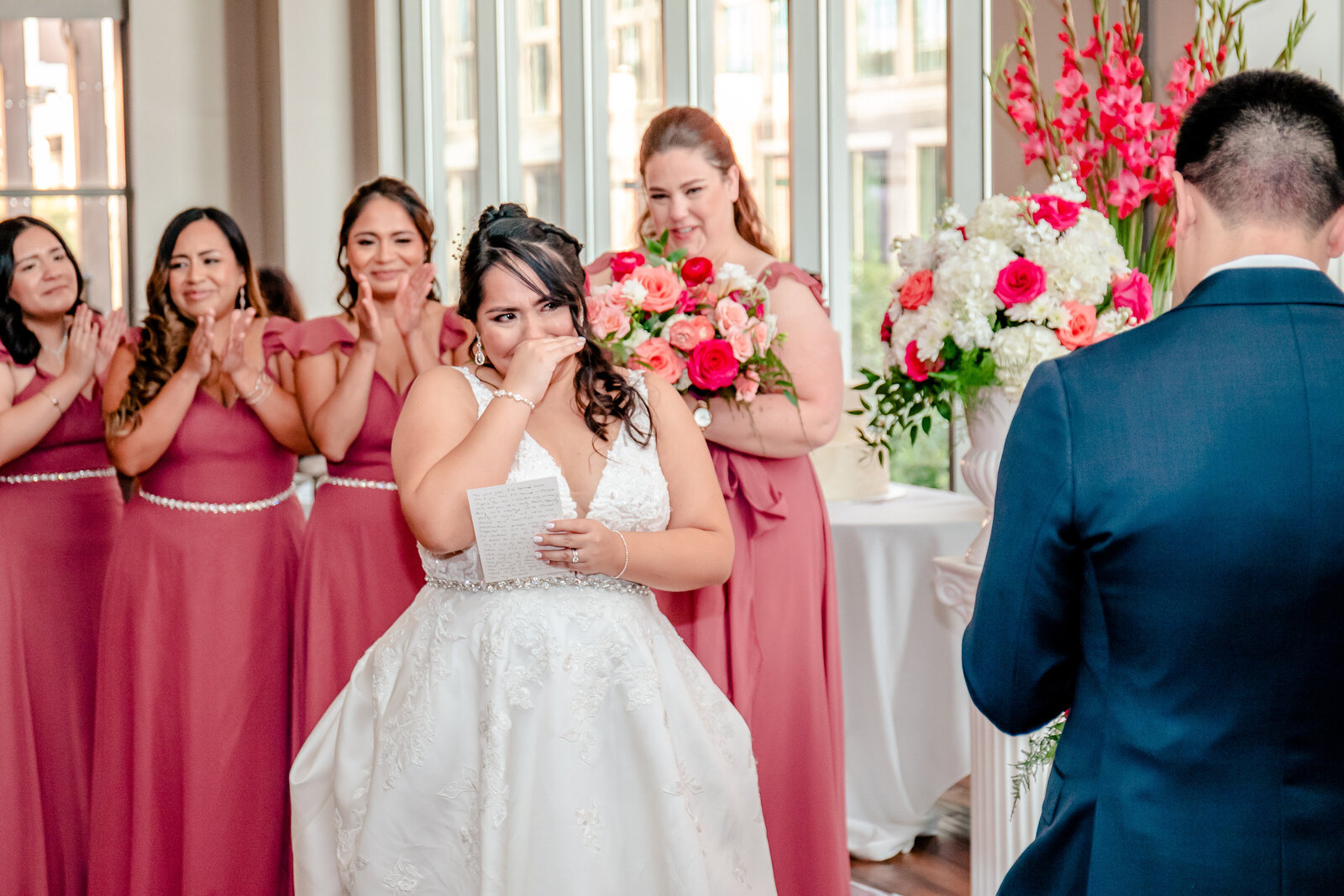A bride getting emotional during the exchange of vows during her wedding in Washington DC