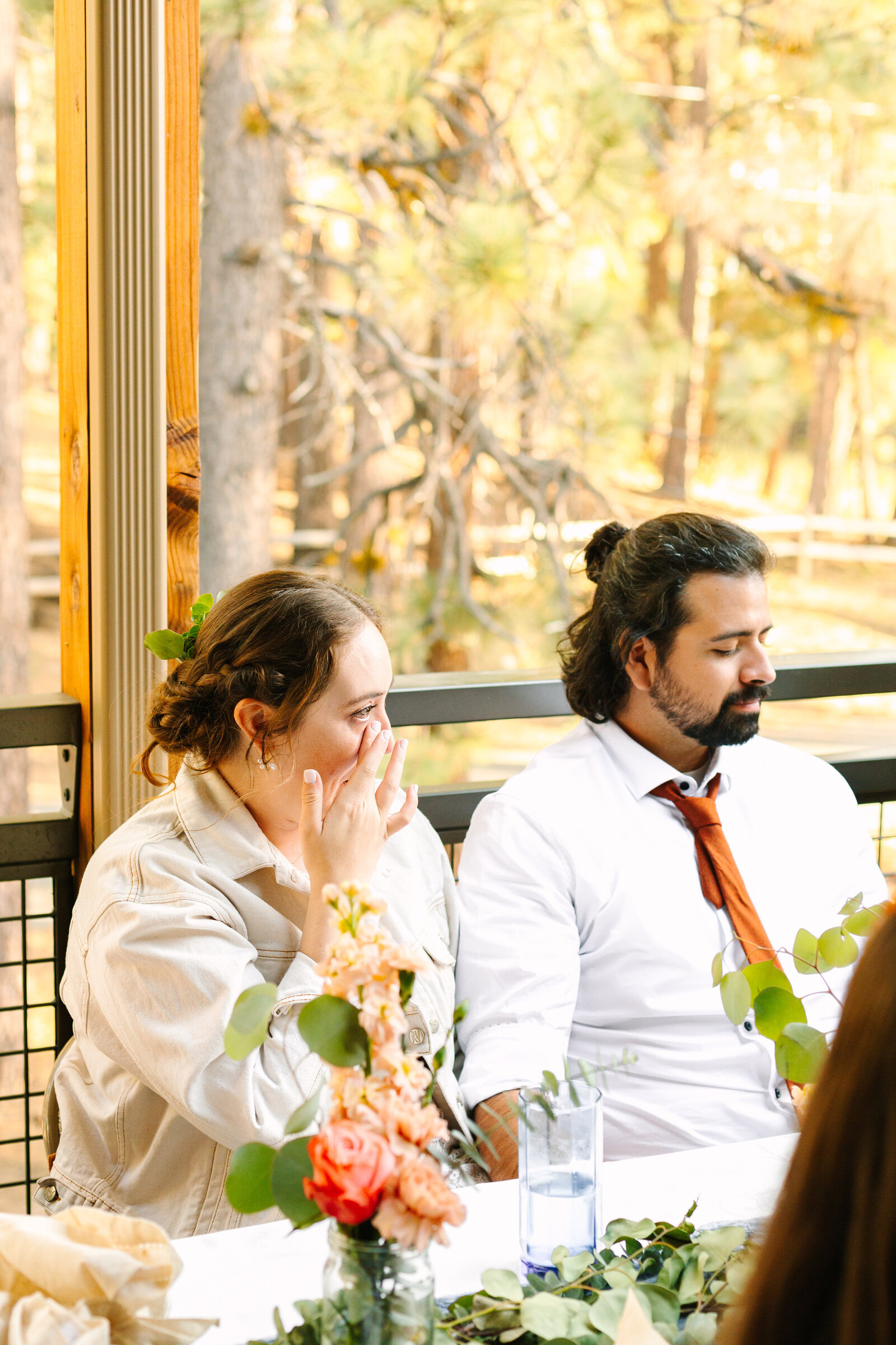 A couple celebrates their intimate elopement at a cabin at Big Bear Lake, California.