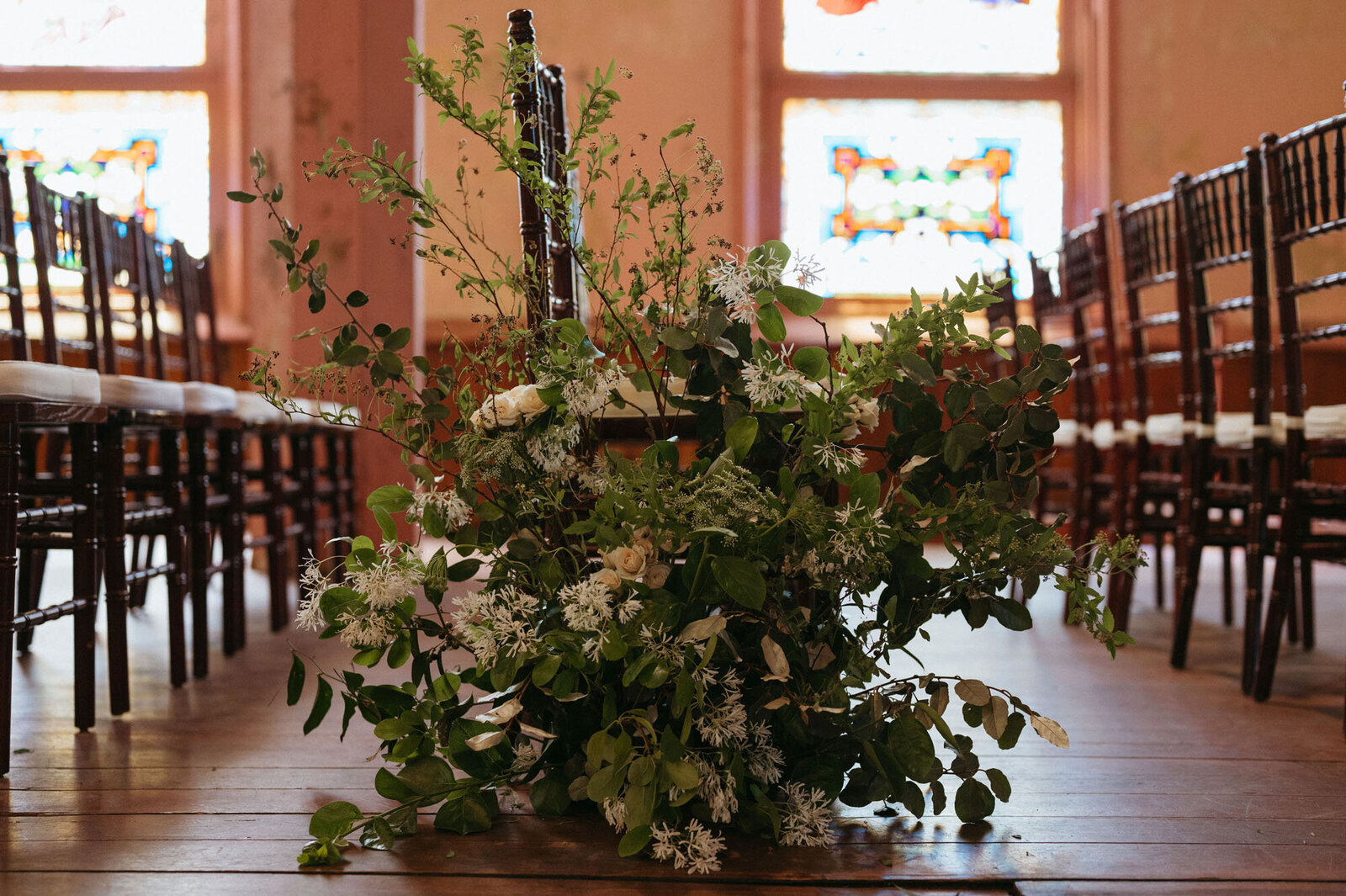 greenery arrangement at luxury wedding ceremony