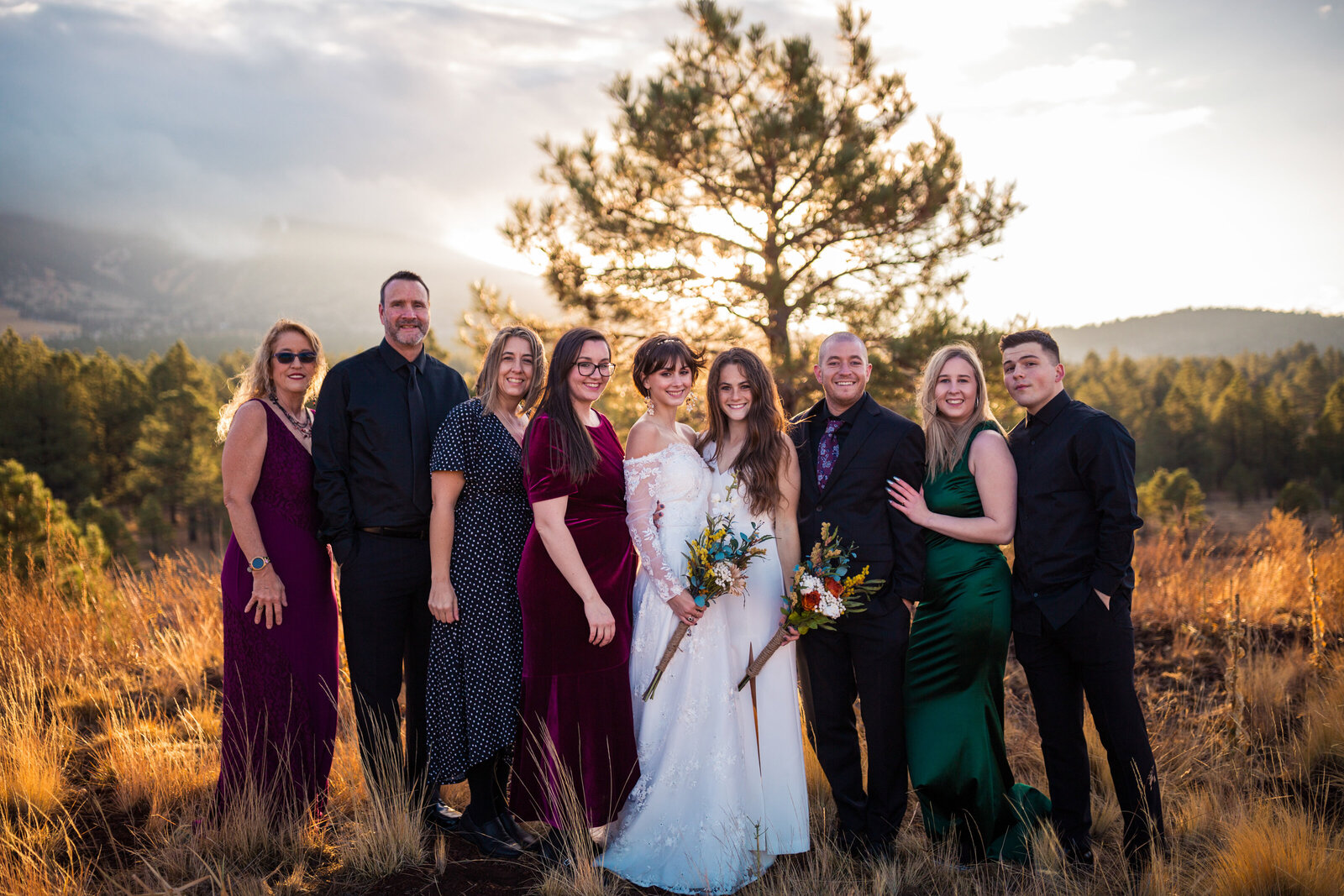 lesbian couple with family on elopement day