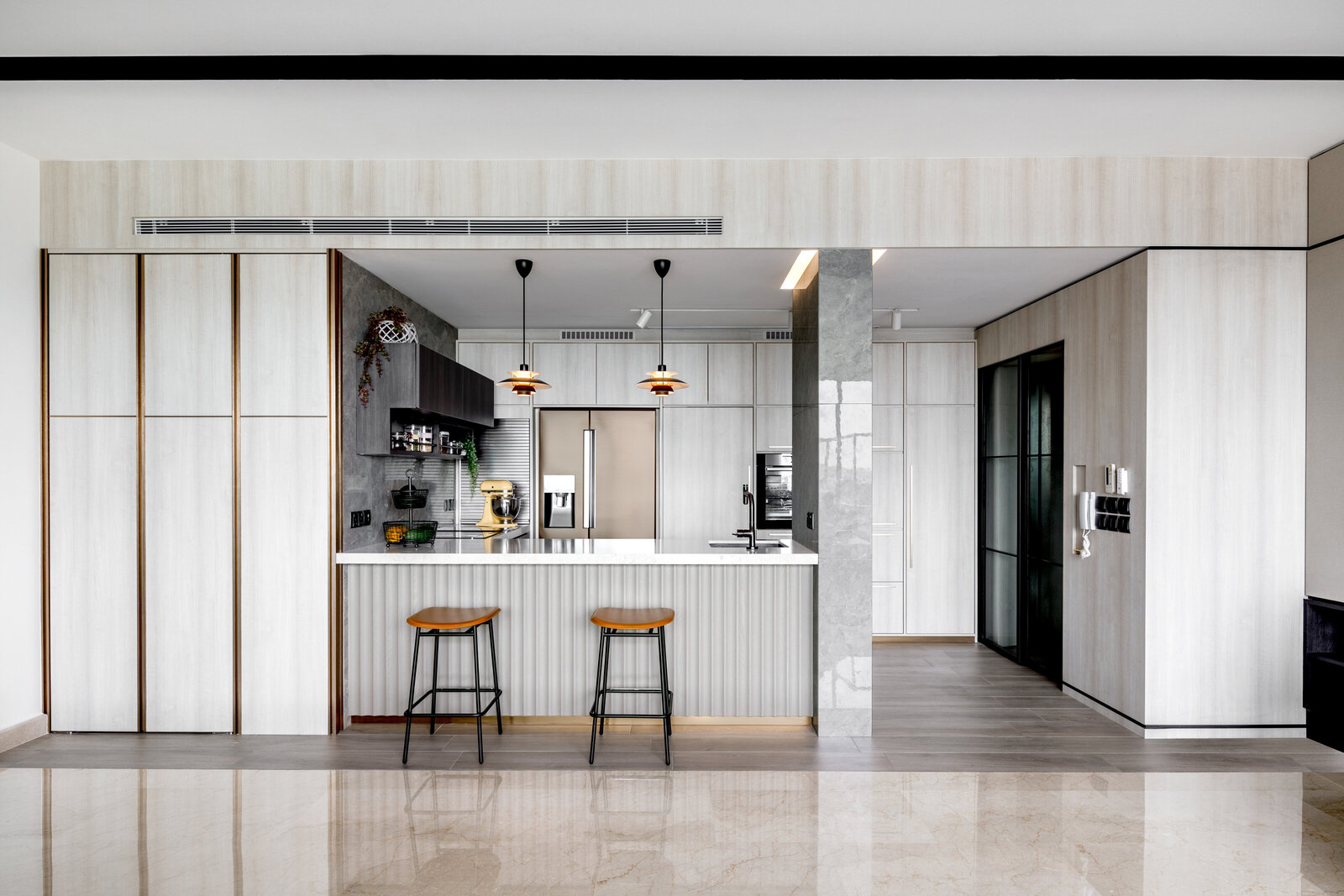 kitchen island with stools and lights