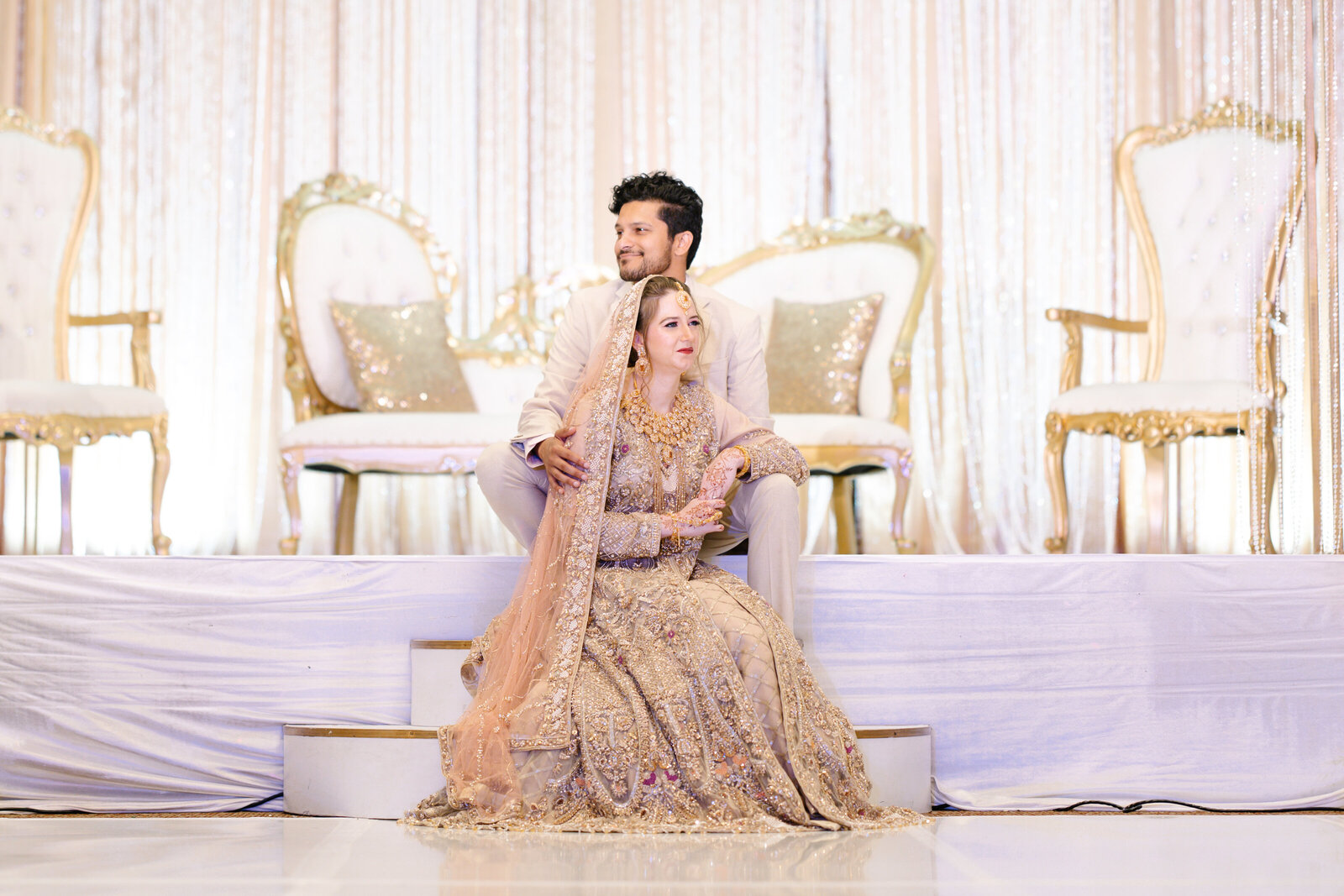 Bride-and-groom-sitting-on-the-stage