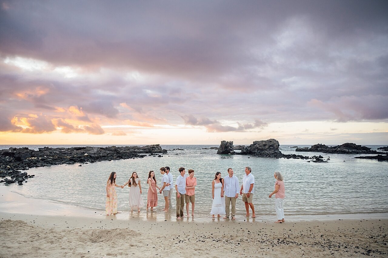 large family group at the beach in hawaii