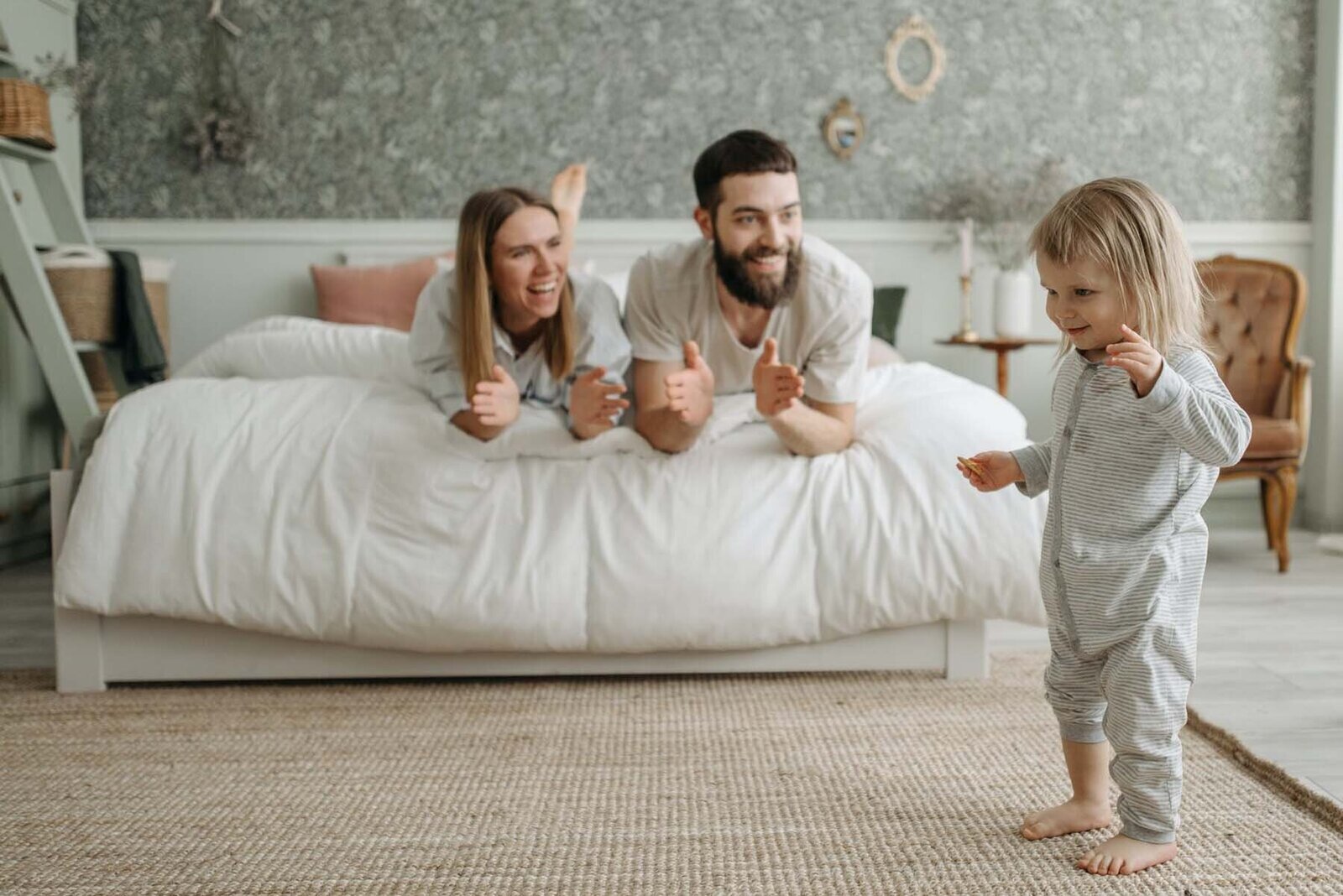 A joyful family embodying the successful application of peaceful parenting, sharing a moment of laughter and connection.
