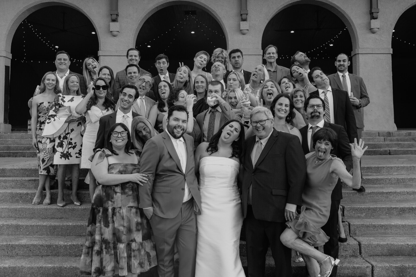Black and white image of family picture at wedding outside of World's Fair Pavilion in St. Louis.