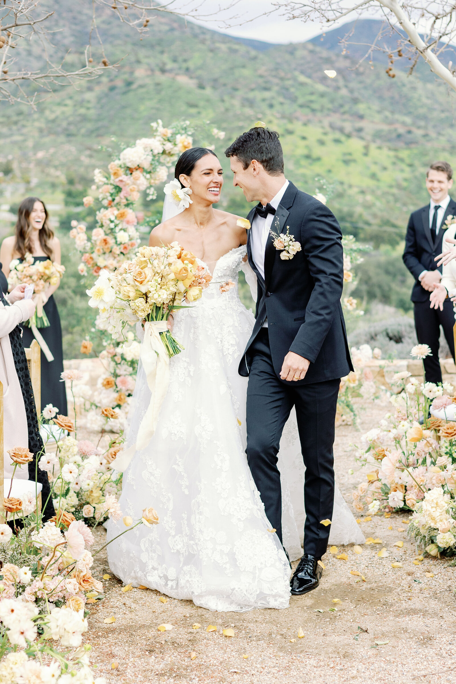 wedding pictures of bride adn groom exiting their wedding ceremony at Ojai wedding venue captured by wedding photographer bay area