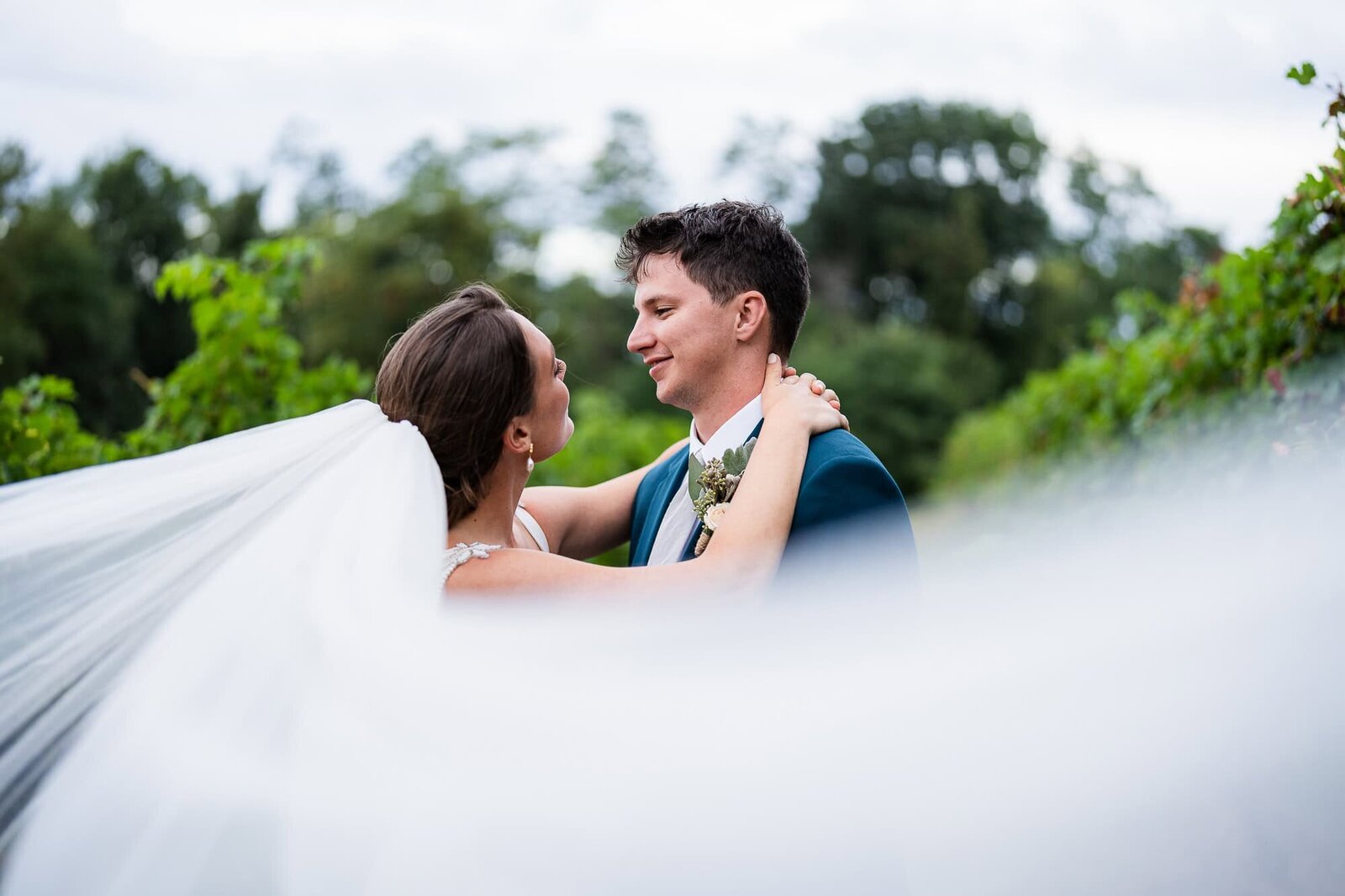 bride and groom dreamy veil photo at their North GA wedding