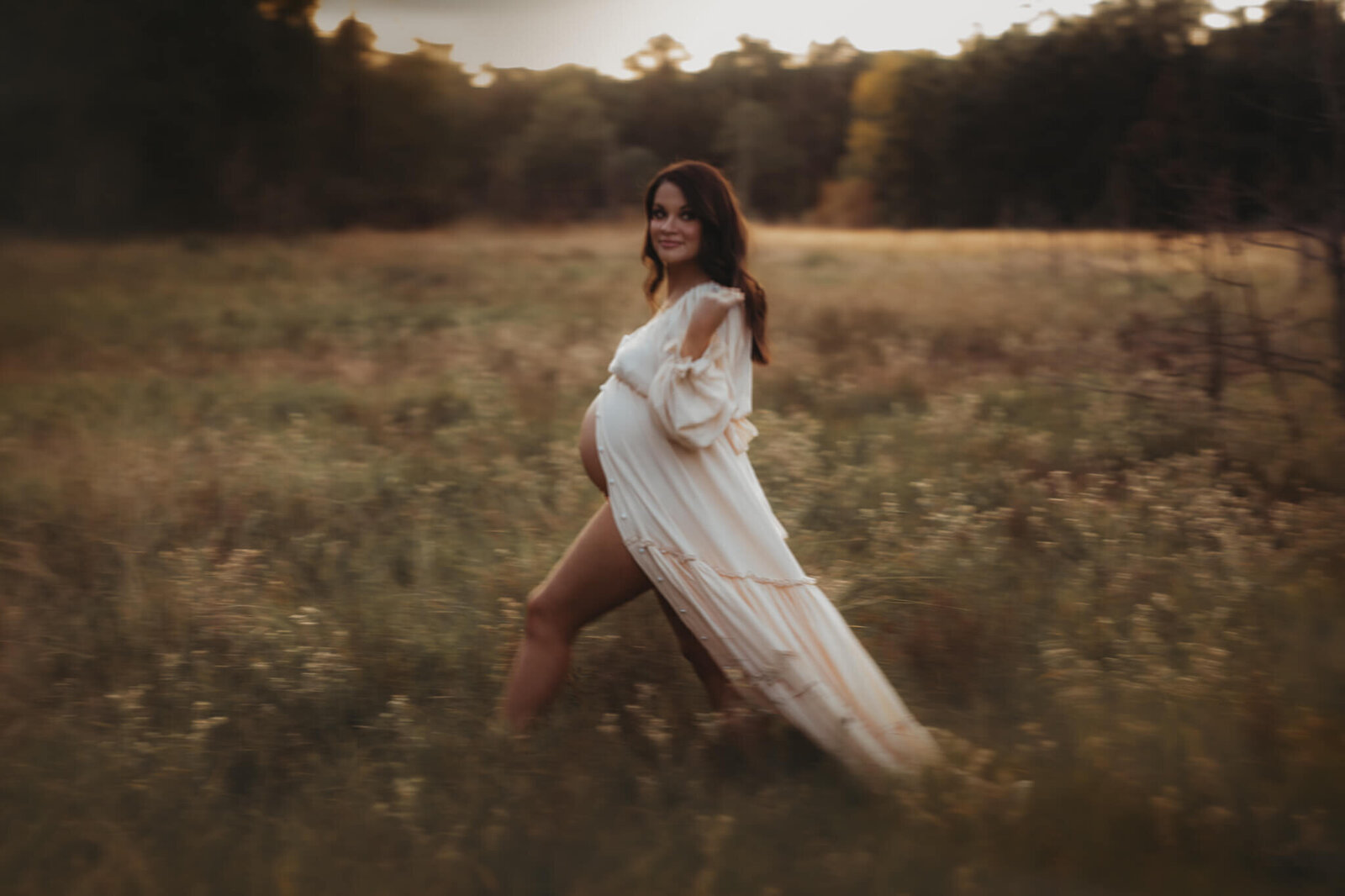 Maternity portrait in soft, natural light with a focus on calm and anticipation.